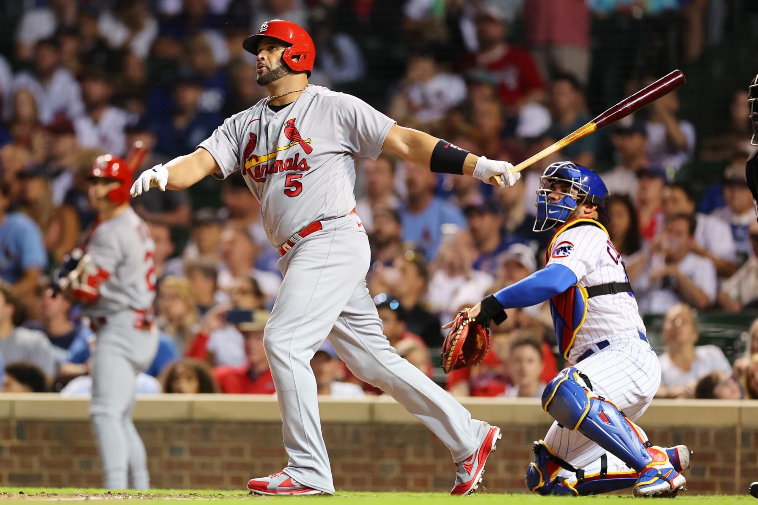 CHICAGO, ILLINOIS - AUGUST 22: Albert Pujols #5 of the St. Louis Cardinals hits a solo home run during the seventh inning off Drew Smyly #11 of the Chicago Cubs (not pictured) at Wrigley Field on August 22, 2022 in Chicago, Illinois. (Photo by Michael Reaves/Getty Images)