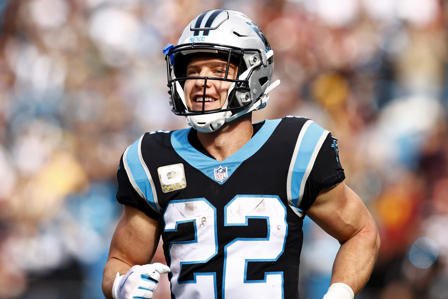 CHARLOTTE, NORTH CAROLINA - NOVEMBER 21: Christian McCaffrey #22 of the Carolina Panthers celebrate the first touchdown    during the first quarter of the game against the Washington Football Team at Bank of America Stadium on November 21, 2021 in Charlotte, North Carolina. (Photo by Jared C. Tilton/Getty Images)