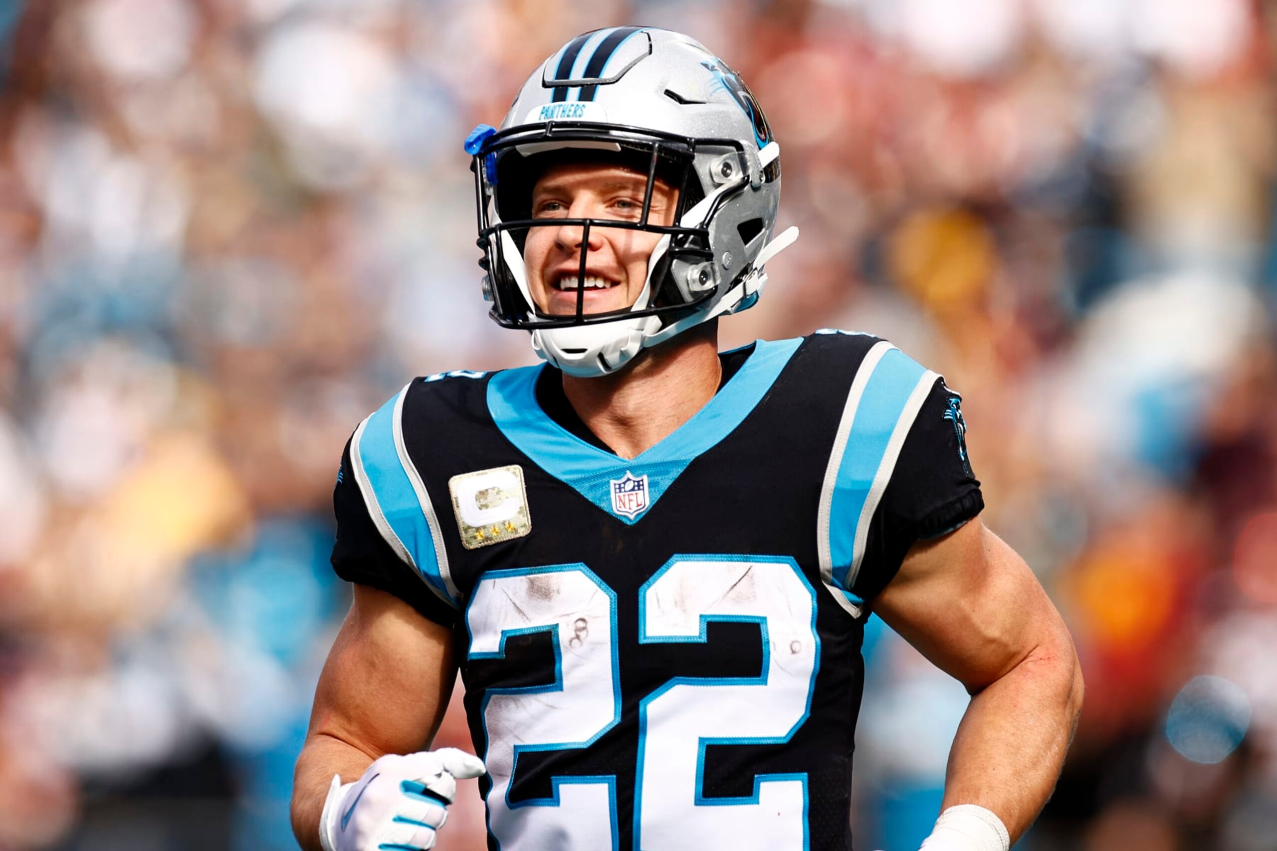 CHARLOTTE, NORTH CAROLINA - NOVEMBER 21: Christian McCaffrey #22 of the Carolina Panthers celebrate the first touchdown    during the first quarter of the game against the Washington Football Team at Bank of America Stadium on November 21, 2021 in Charlotte, North Carolina. (Photo by Jared C. Tilton/Getty Images)