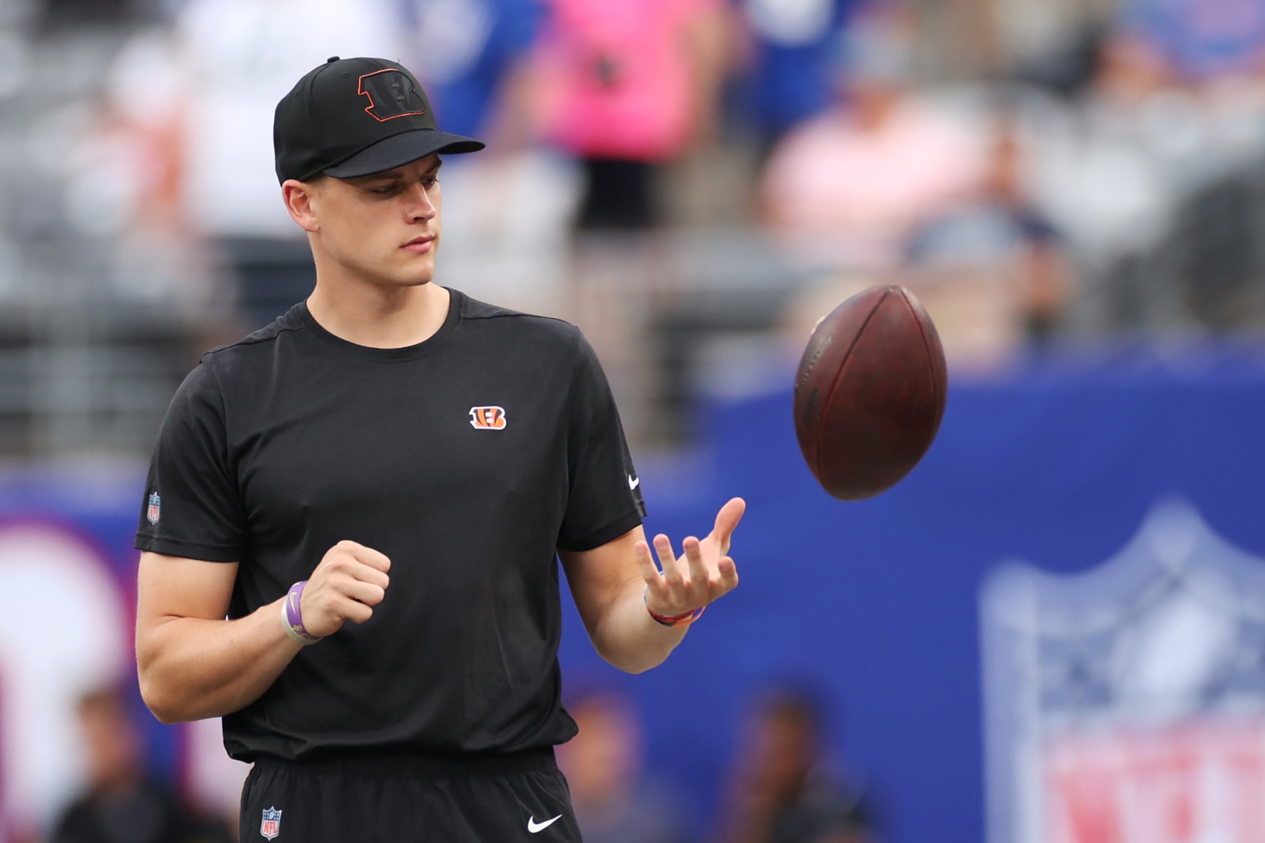 EAST RUTHERFORD, NEW JERSEY - AUGUST 21: Joe Burrow #9 of the Cincinnati Bengals throws the football during warmups of a preseason game against the New York Giants at MetLife Stadium on August 21, 2022 in East Rutherford, New Jersey. (Photo by Sarah Stier/Getty Images)