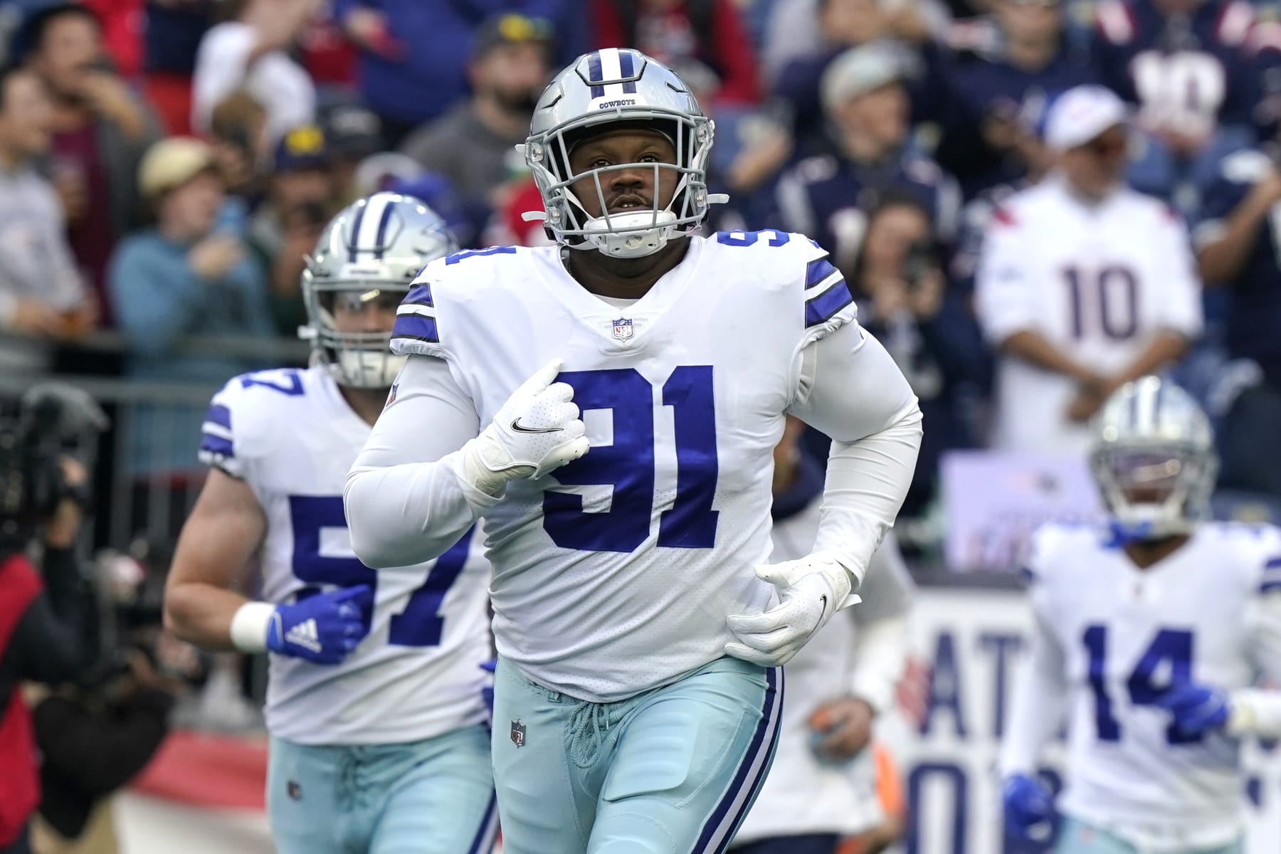 Dallas Cowboys defensive tackle Carlos Watkins (91) runs onto the field before the first half of an NFL football game, Sunday, Oct. 17, 2021, in Foxborough, Mass. (AP Photo/Steven Senne)
