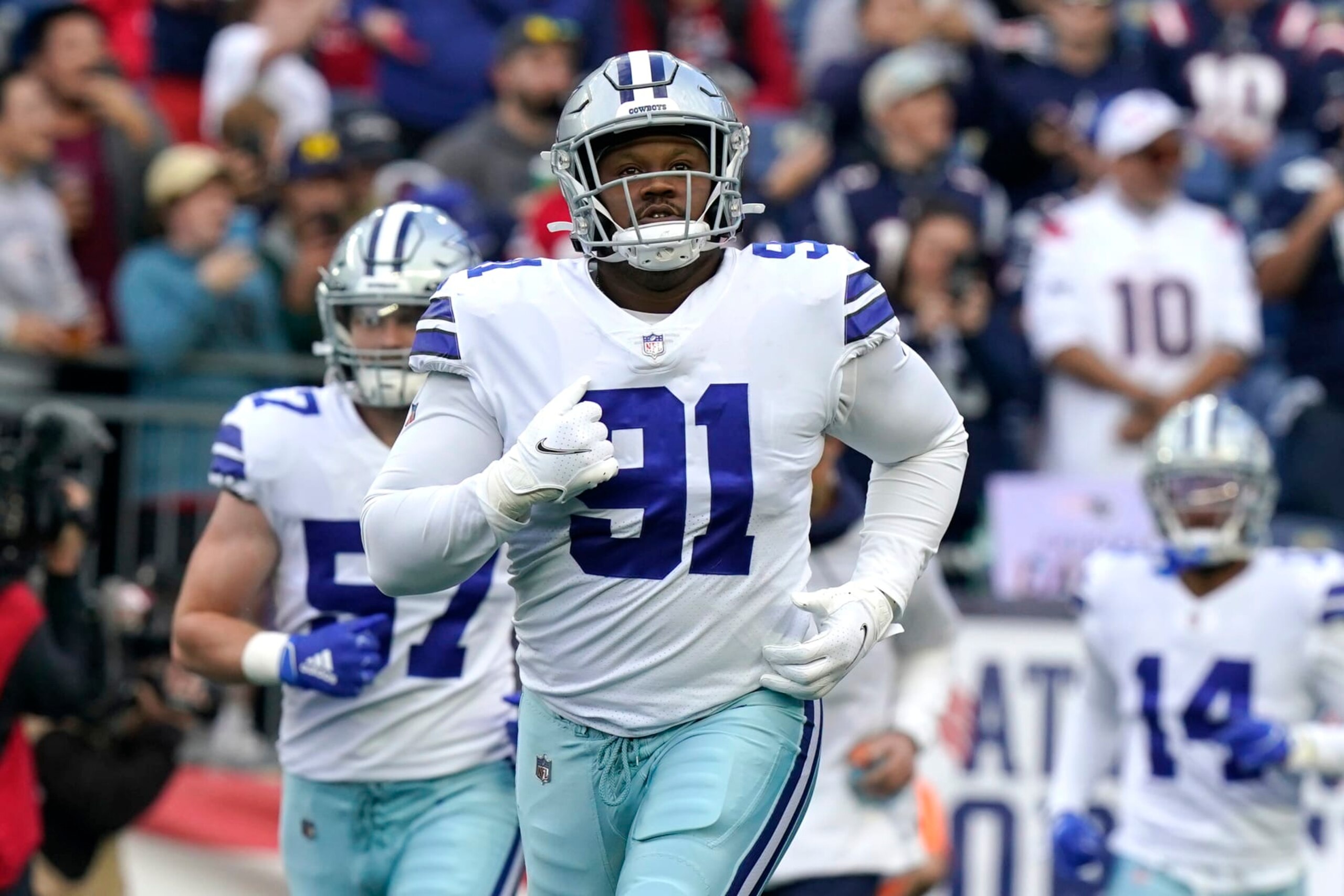 Dallas Cowboys defensive tackle Carlos Watkins (91) runs onto the field before the first half of an NFL football game, Sunday, Oct. 17, 2021, in Foxborough, Mass. (AP Photo/Steven Senne)
