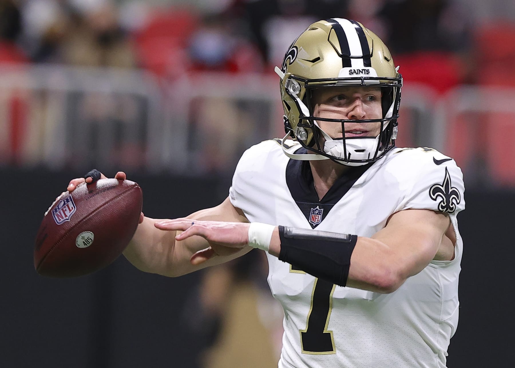 ATLANTA, GA - JANUARY 09: Taysom Hill #7 of the New Orleans Saints rolls out to pass during the first half against the Atlanta Falcons at Mercedes-Benz Stadium on January 9, 2022 in Atlanta, Georgia. (Photo by Todd Kirkland/Getty Images)