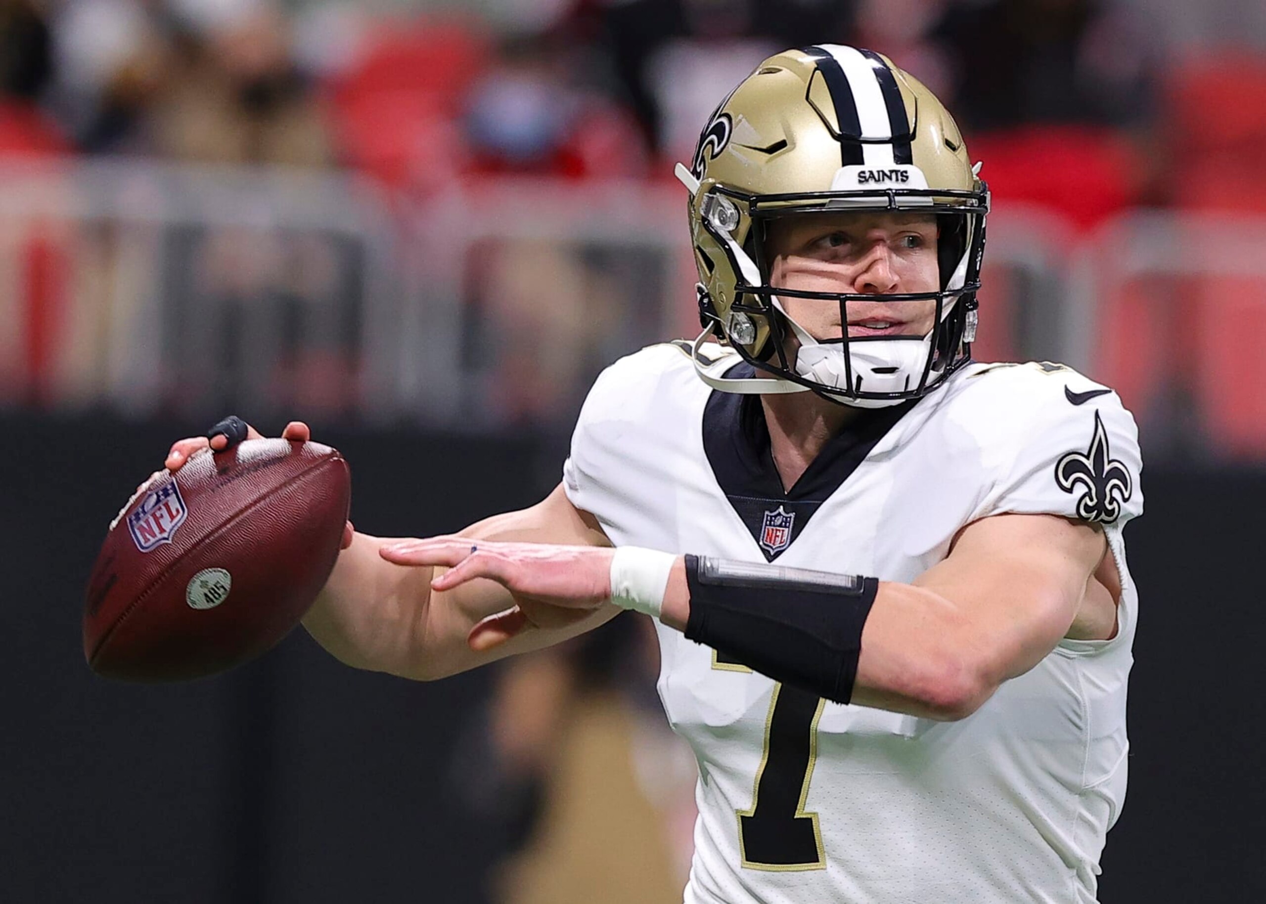 ATLANTA, GA - JANUARY 09: Taysom Hill #7 of the New Orleans Saints rolls out to pass during the first half against the Atlanta Falcons at Mercedes-Benz Stadium on January 9, 2022 in Atlanta, Georgia. (Photo by Todd Kirkland/Getty Images)