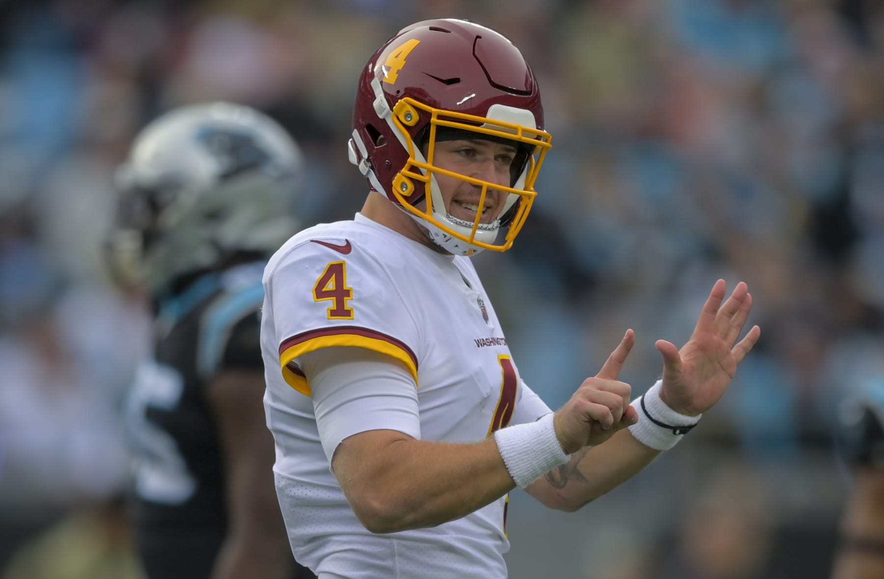 CHARLOTTE, NC - NOVEMBER, 21: Washington Football Team quarterback Taylor Heinicke (4) signals towards the bench during a timeout in the third quarter of the game between the Washington Football Team and the Carolina Panthers at Bank of America Stadium on November 21, 2021 in Charlotte NC. (Photo by John McDonnell/The Washington Post via Getty Images)
