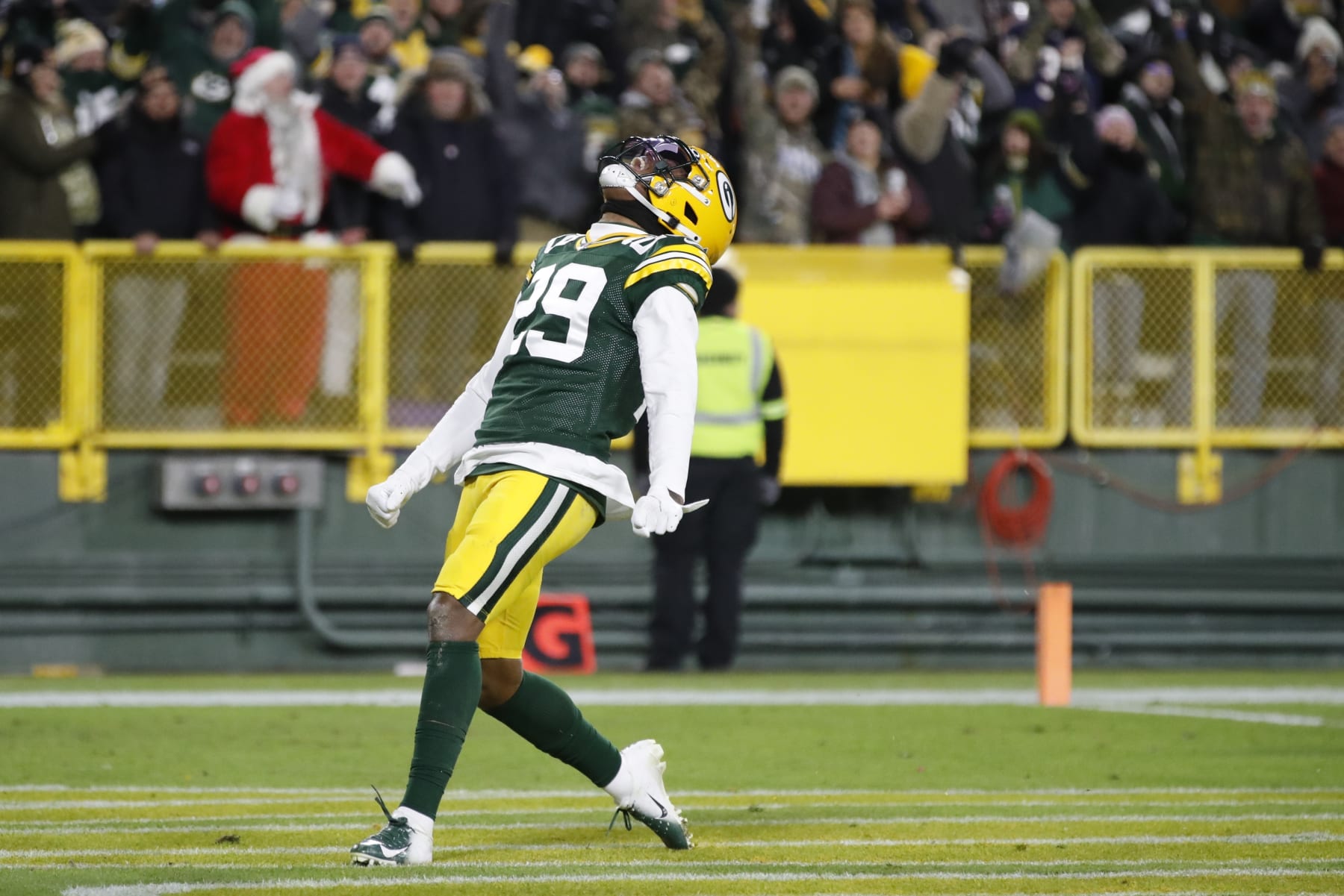Green Bay Packers' Rasul Douglas celebrates his interception he returned for a touchdown during the first half of an NFL football game against the Chicago Bears Sunday, Dec. 12, 2021, in Green Bay, Wis. (AP Photo/Matt Ludtke)
