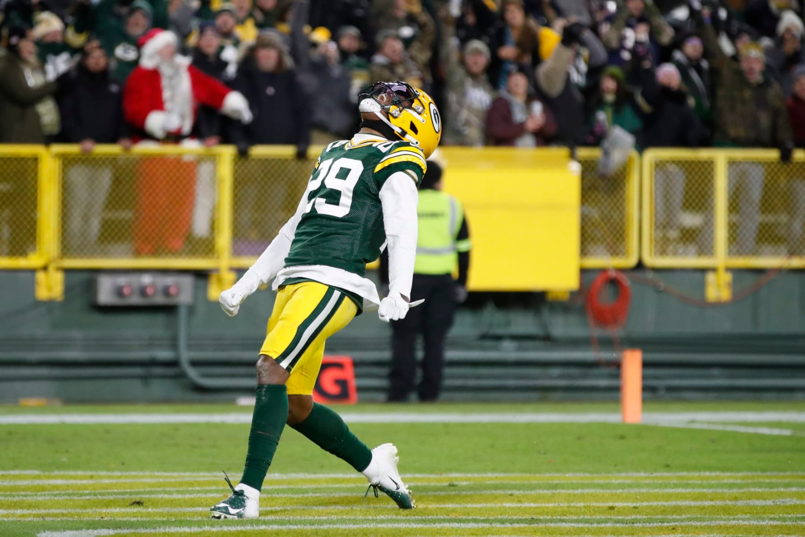 Green Bay Packers' Rasul Douglas celebrates his interception he returned for a touchdown during the first half of an NFL football game against the Chicago Bears Sunday, Dec. 12, 2021, in Green Bay, Wis. (AP Photo/Matt Ludtke)