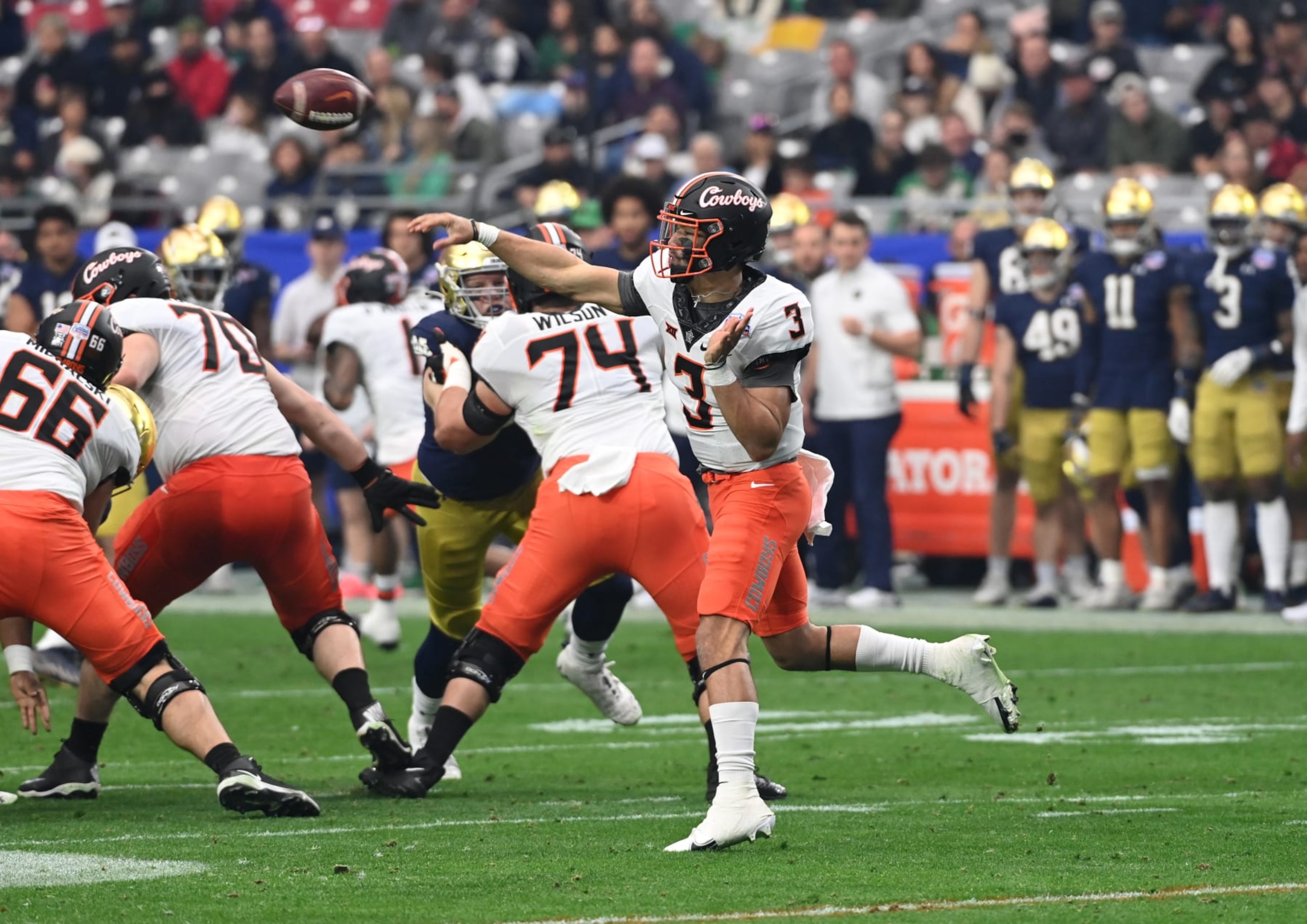 GLENDALE, ARIZONA - JANUARY 01: Spencer Sanders #3 of the Oklahoma State University Cowboys throws the ball against the Notre Dame Fighting Irish during the Play Station Fiesta Bowl at State Farm Stadium on January 01, 2022 in Glendale, Arizona. (Photo by Norm Hall/Getty Images) GLENDALE, ARIZONA - JANUARY 01: Spencer Sanders #3 of the Oklahoma State University Cowboys throws the ball against the Notre Dame Fighting Irish during the Play Station Fiesta Bowl at State Farm Stadium on January 01, 2022 in Glendale, Arizona. (Photo by Norm Hall/Getty Images)