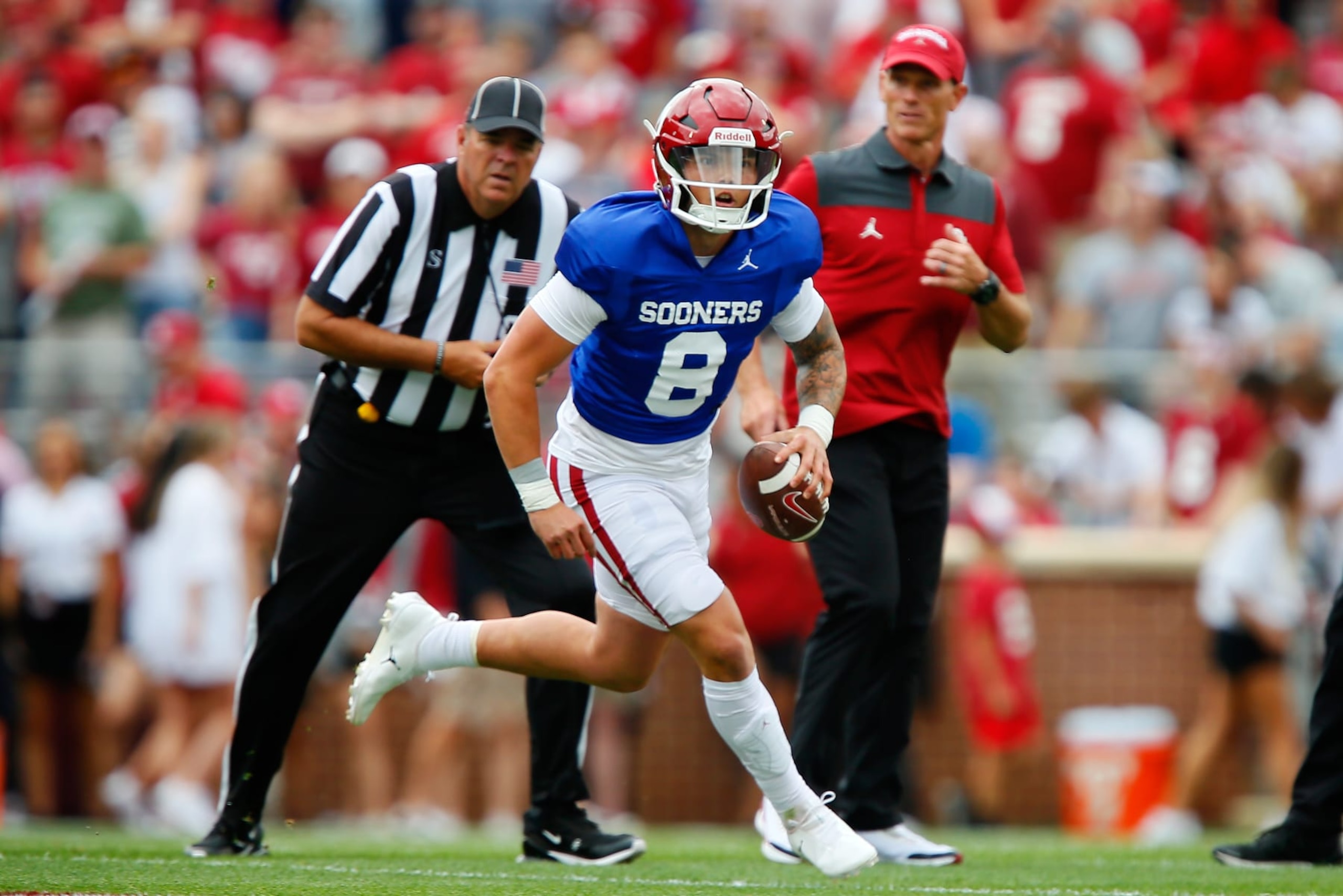 NORMAN, OK - APRIL 23: Starting quarterback Dillon Gabriel #8 of the Oklahoma Sooners rolls out of the pocket under watch of head coach Brent Venables during their spring game at Gaylord Family Oklahoma Memorial Stadium on April 23, 2022 in Norman, Oklahoma. (Photo by Brian Bahr/Getty Images) NORMAN, OK - APRIL 23: Starting quarterback Dillon Gabriel #8 of the Oklahoma Sooners rolls out of the pocket under watch of head coach Brent Venables during their spring game at Gaylord Family Oklahoma Memorial Stadium on April 23, 2022 in Norman, Oklahoma. (Photo by Brian Bahr/Getty Images)