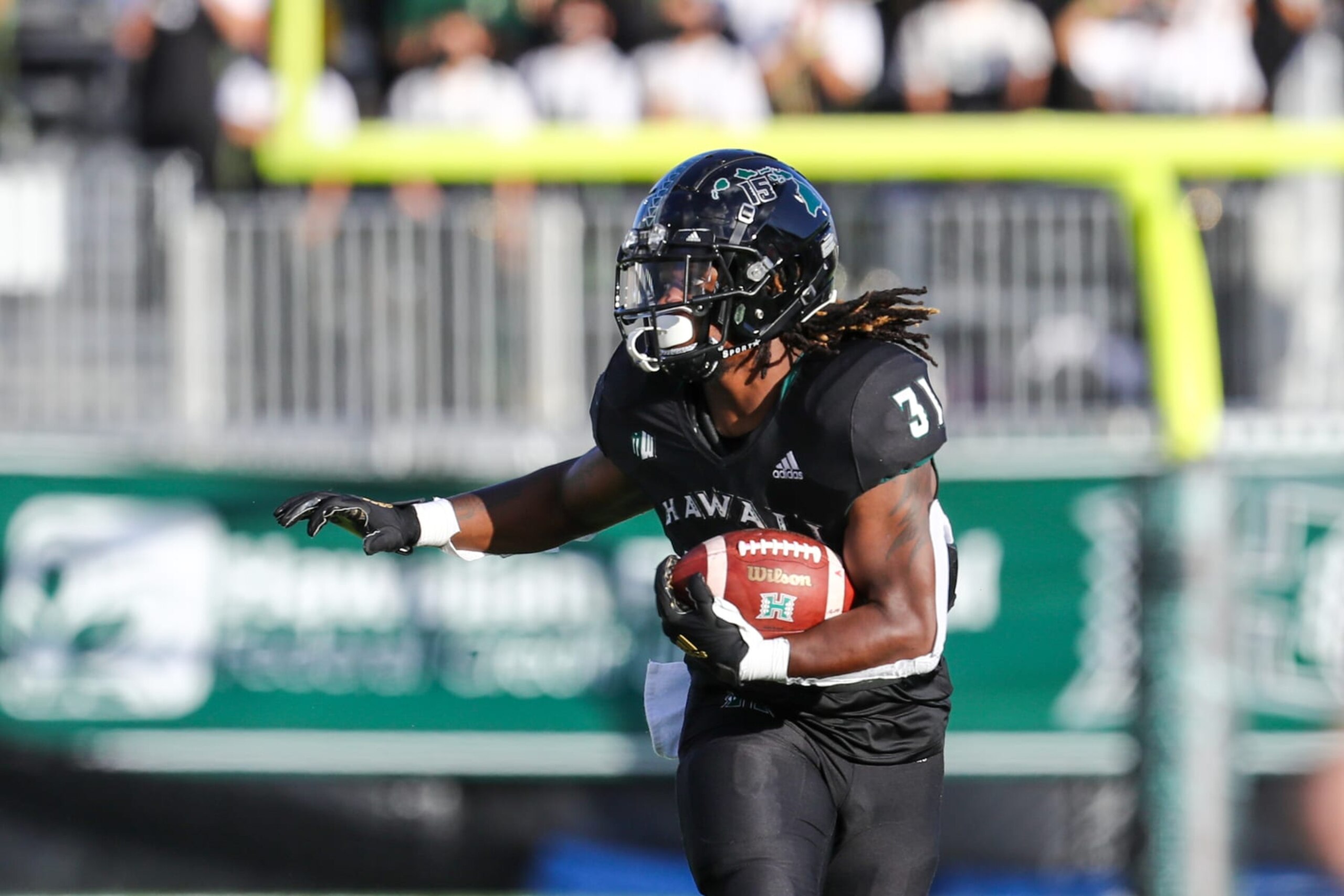 HONOLULU, HI - OCTOBER 02: Dedrick Parson #31 of the Hawaii Rainbow Warriors runs the ball during the first half of an NCAA football game against the Fresno State Bulldogs at the Clarance T.C. Ching Complex on October 2, 2021 in Honolulu, Hawaii. (Photo by Darryl Oumi/Getty Images)
