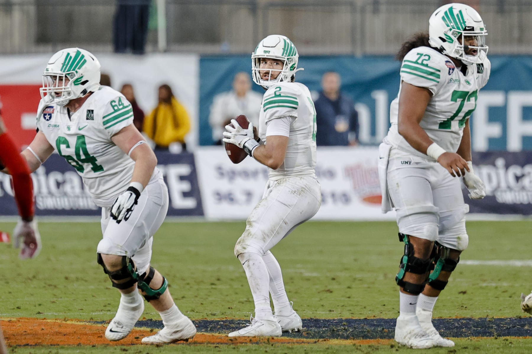 FRISCO, TX - DECEMBER 23: North Texas Mean Green quarterback Austin Aune (2) looks for an open receiver during the Frisco Football Classic Bowl between the North Texas Mean Green and the Miami (Oh) Redhawks on December 23, 2021 at Toyota Stadium in Frisco, Texas. (Photo by Matthew Pearce/Icon Sportswire via Getty Images)