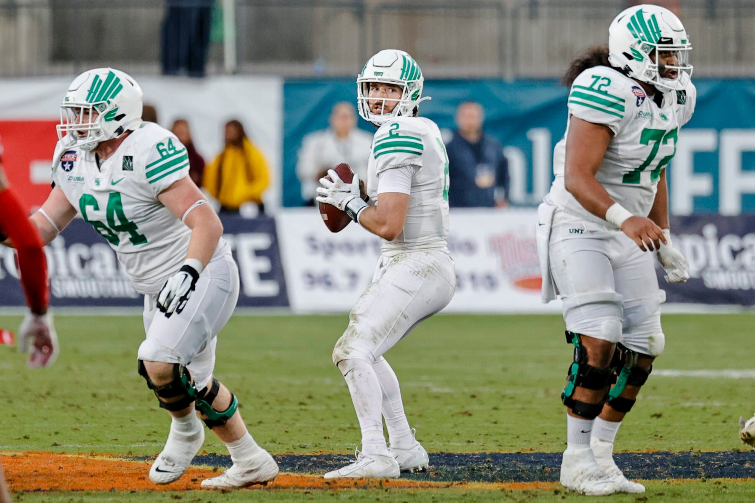 FRISCO, TX - DECEMBER 23: North Texas Mean Green quarterback Austin Aune (2) looks for an open receiver during the Frisco Football Classic Bowl between the North Texas Mean Green and the Miami (Oh) Redhawks on December 23, 2021 at Toyota Stadium in Frisco, Texas. (Photo by Matthew Pearce/Icon Sportswire via Getty Images)