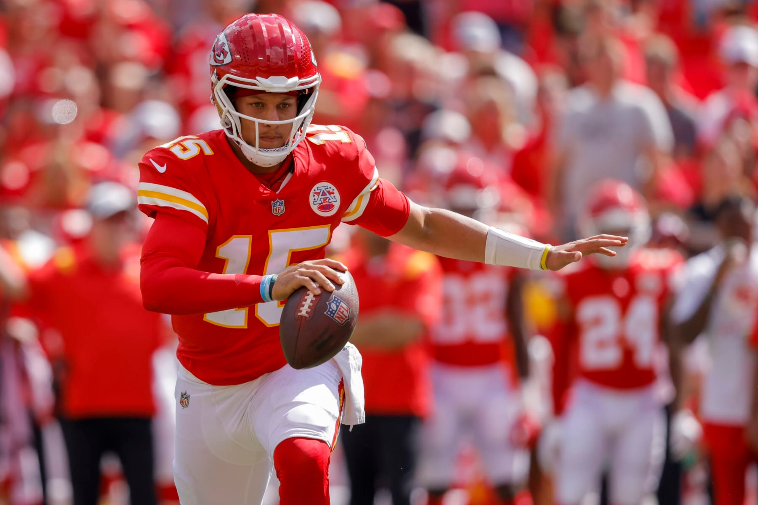 KANSAS CITY, MO - AUGUST 20: Patrick Mahomes #15 of the Kansas City Chiefs scrambles away from defensive pressure during the first quarter of a preseason game against the Washington Commanders at Arrowhead Stadium on August 20, 2022 in Kansas City, Missouri. (Photo by David Eulitt/Getty Images)