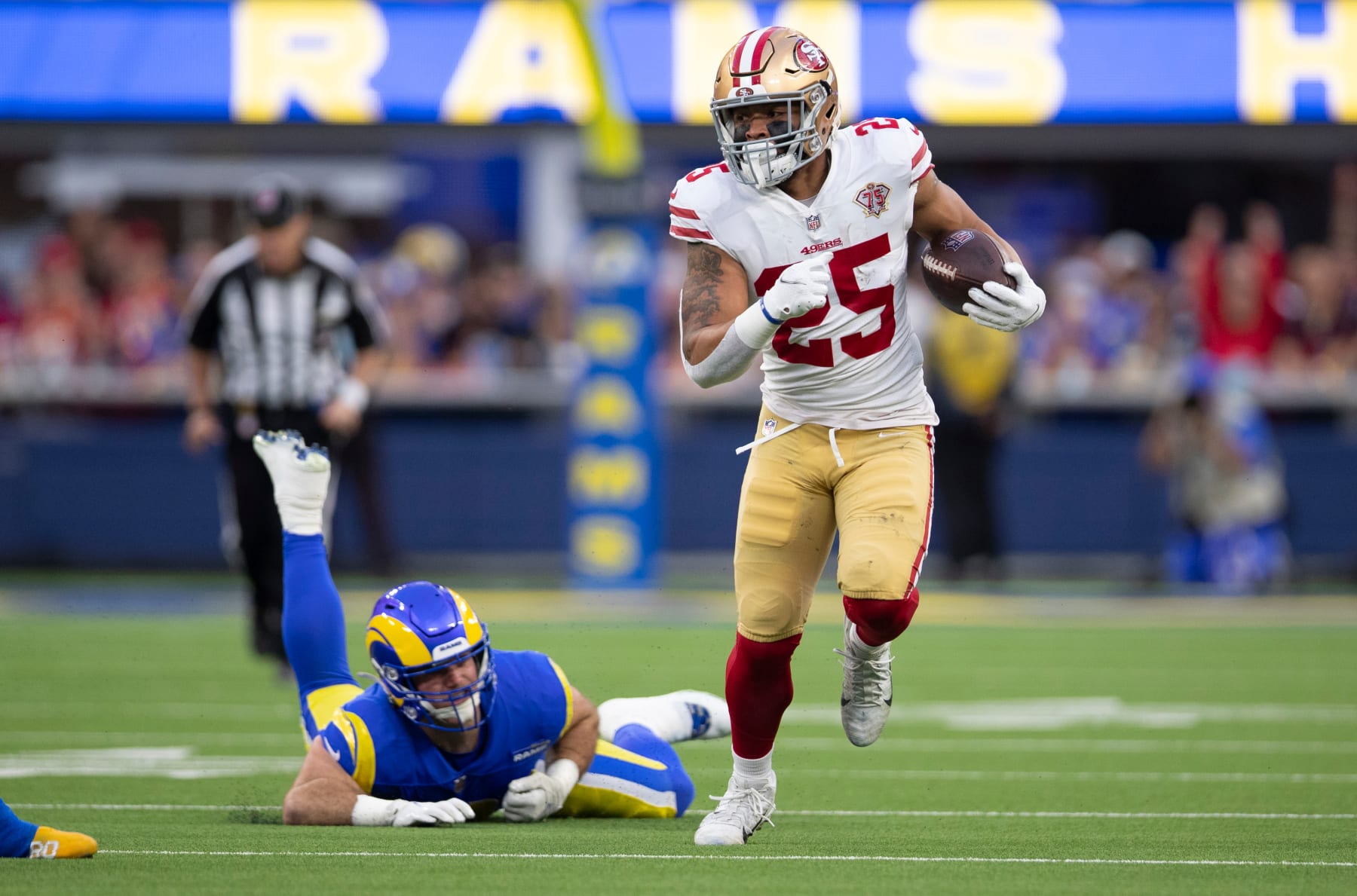 INGLEWOOD, CA - JANUARY 30: Elijah Mitchell #25 of the San Francisco 49ers runs after making a catch during the game against the Los Angeles Rams at SoFi Stadium on January 30, 2022 in Inglewood, California. The Rams defeated the 49ers 20-17. (Photo by Michael Zagaris/San Francisco 49ers/Getty Images)