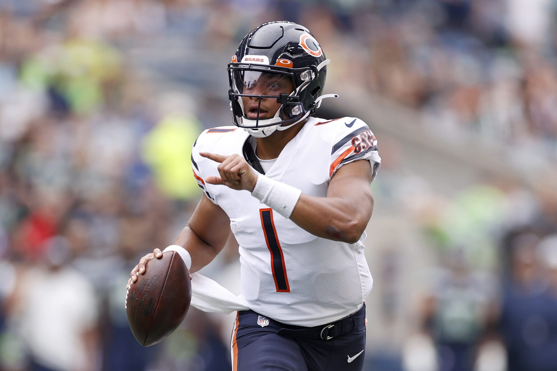 SEATTLE, WASHINGTON - AUGUST 18: Justin Fields #1 of the Chicago Bears looks to pass \in the first half during the preseason game between the Seattle Seahawks and the Chicago Bears at Lumen Field on August 18, 2022 in Seattle, Washington. (Photo by Steph Chambers/Getty Images)