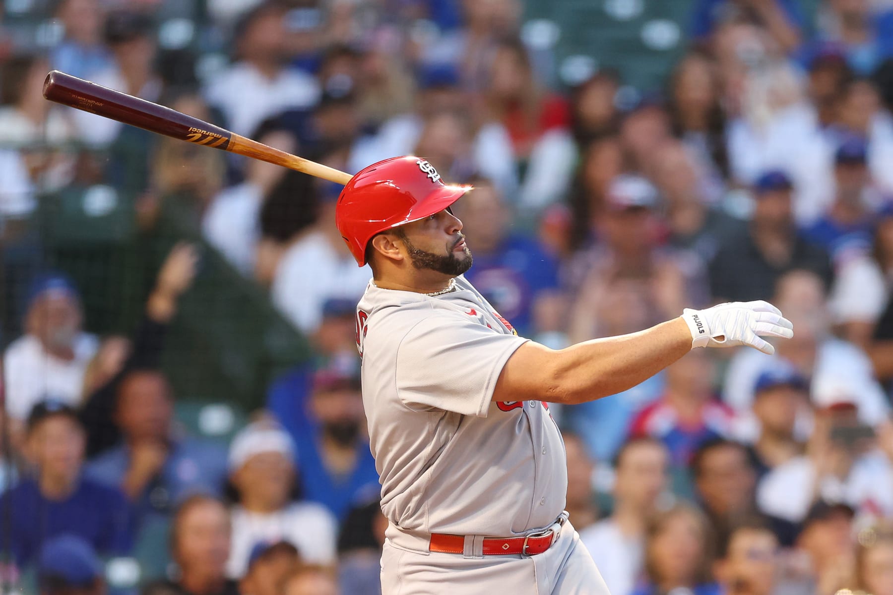 CHICAGO, ILLINOIS - AUGUST 22: Albert Pujols #5 of the St. Louis Cardinals singles during the first inning against the Chicago Cubs at Wrigley Field on August 22, 2022 in Chicago, Illinois. (Photo by Michael Reaves/Getty Images)