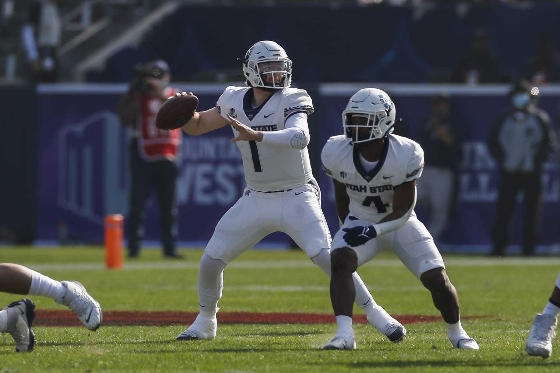 LOS ANGELES, CA - DECEMBER 04: Utah State Aggies quarterback Logan Bonner (1) passes the ball during the Mountain West Championship college football game between the Utah State Aggies and the San Diego State Aztecs on December 04, 2021, at Dignity Health Sports Park in Los Angeles, CA (Photo by Brandon Sloter/Icon Sportswire via Getty Images)