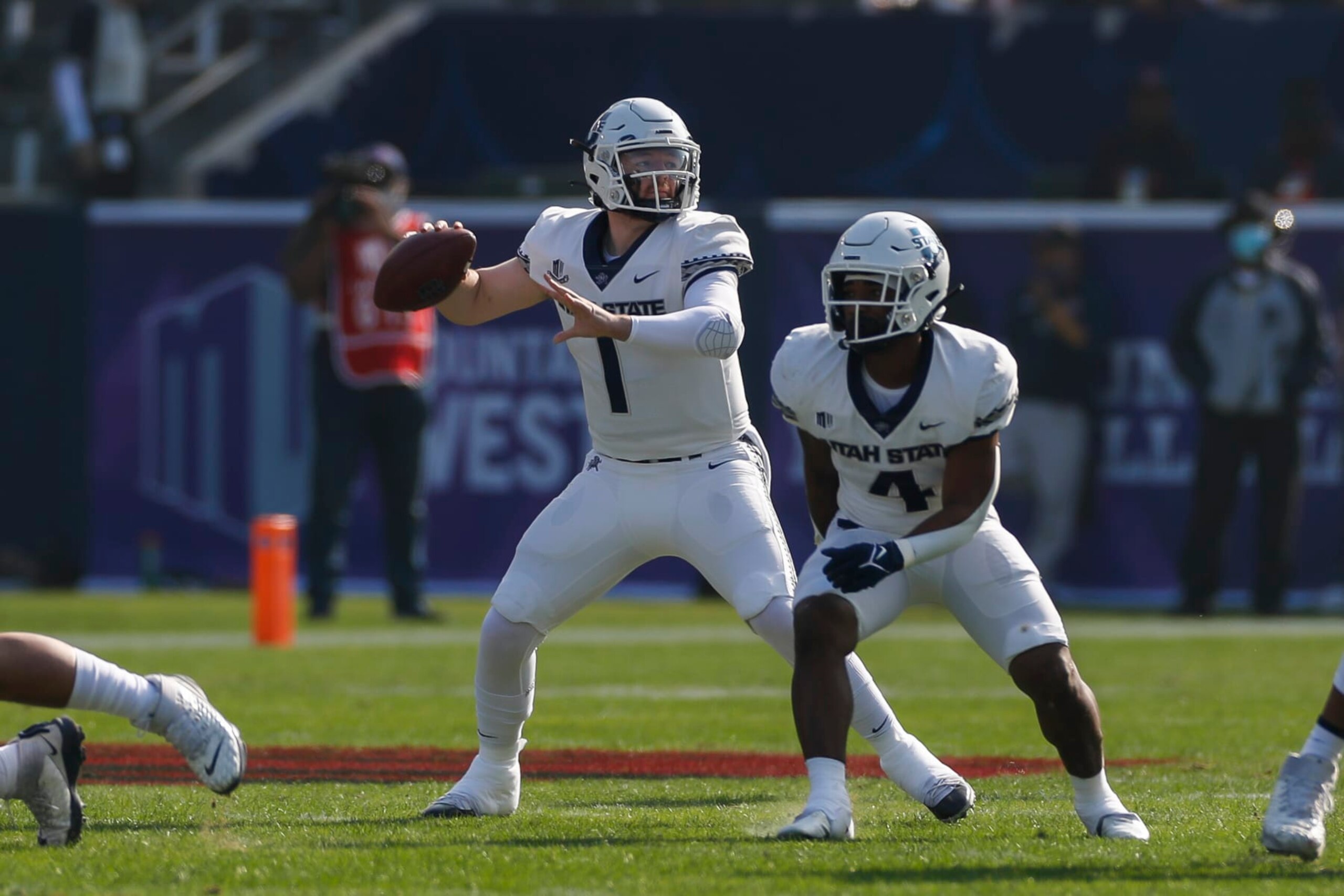 LOS ANGELES, CA - DECEMBER 04: Utah State Aggies quarterback Logan Bonner (1) passes the ball during the Mountain West Championship college football game between the Utah State Aggies and the San Diego State Aztecs on December 04, 2021, at Dignity Health Sports Park in Los Angeles, CA (Photo by Brandon Sloter/Icon Sportswire via Getty Images)