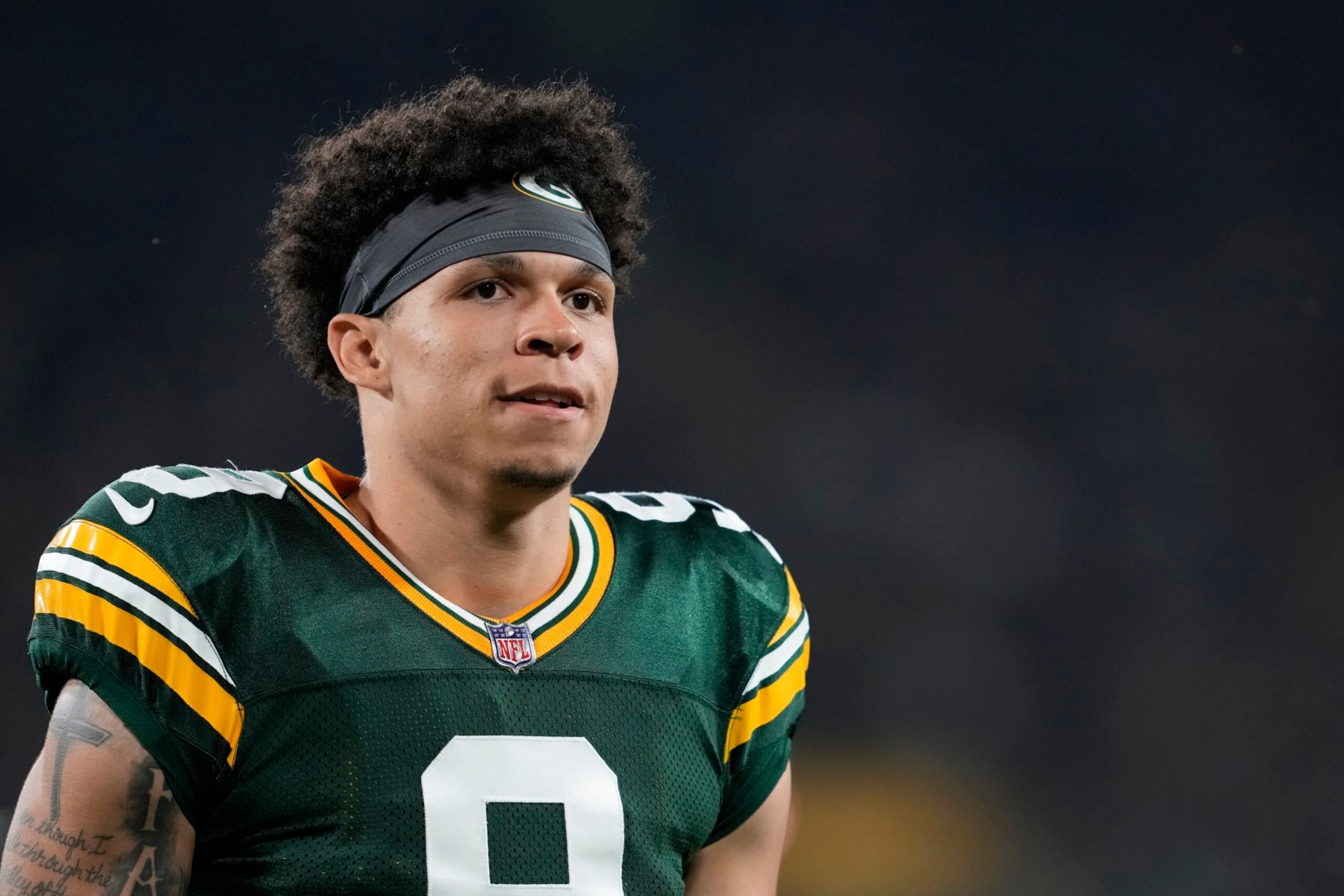 GREEN BAY, WISCONSIN - AUGUST 19: Christian Watson #9 of the Green Bay Packers walks off the field after the first half against the New Orleans Saints during a preseason game at Lambeau Field on August 19, 2022 in Green Bay, Wisconsin. (Photo by Patrick McDermott/Getty Images)