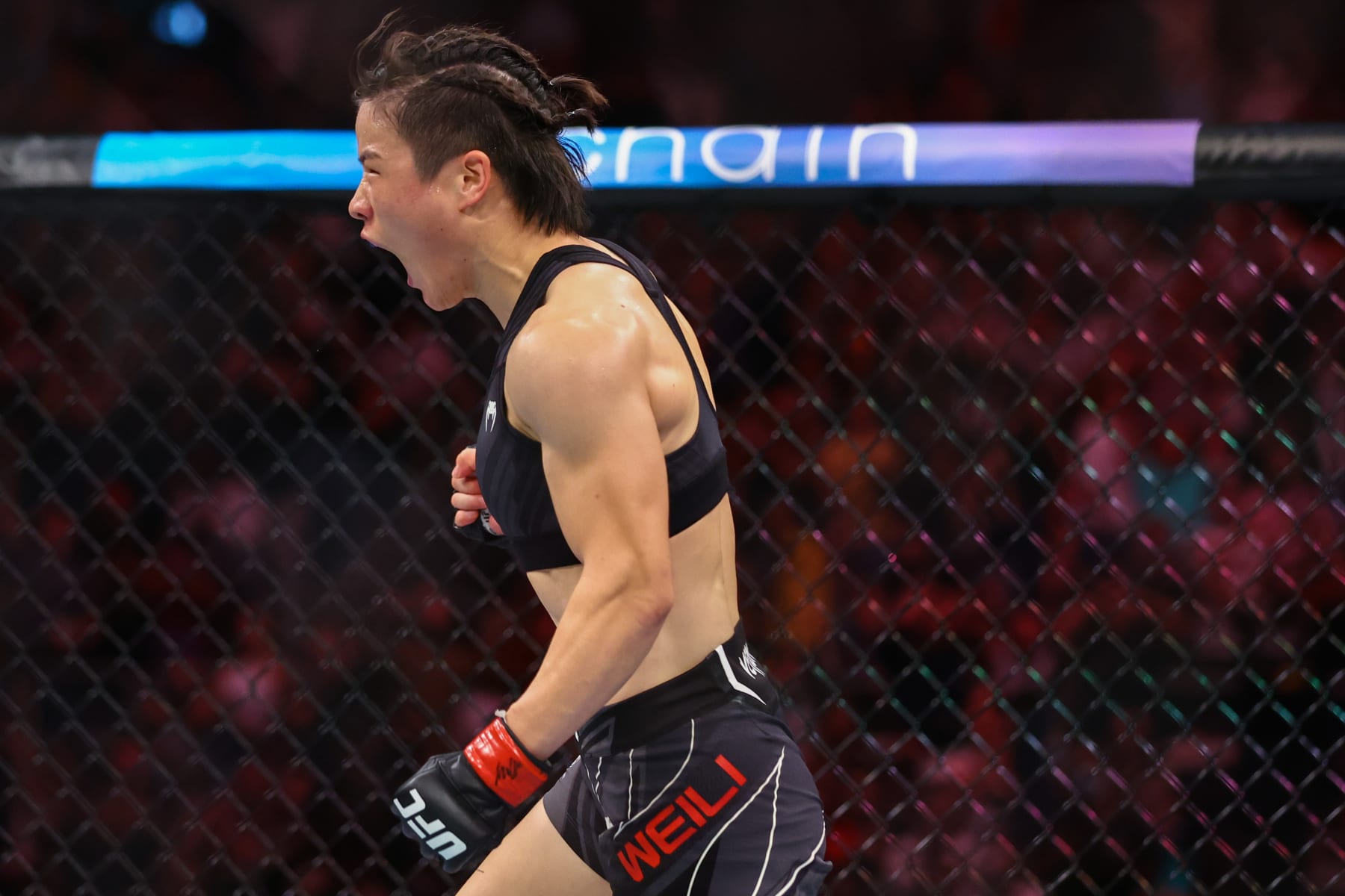 SINGAPORE, SINGAPORE - JUNE 12: Zhang Weili of China
reacts after defeating Joanna Jedrzejcyk of Poland during their Women's Strawweight Fight at Singapore Indoor Stadium on June 12, 2022 in Singapore. (Photo by Yong Teck Lim/Getty Images) SINGAPORE, SINGAPORE - JUNE 12: Zhang Weili of China
reacts after defeating Joanna Jedrzejcyk of Poland during their Women's Strawweight Fight at Singapore Indoor Stadium on June 12, 2022 in Singapore. (Photo by Yong Teck Lim/Getty Images)