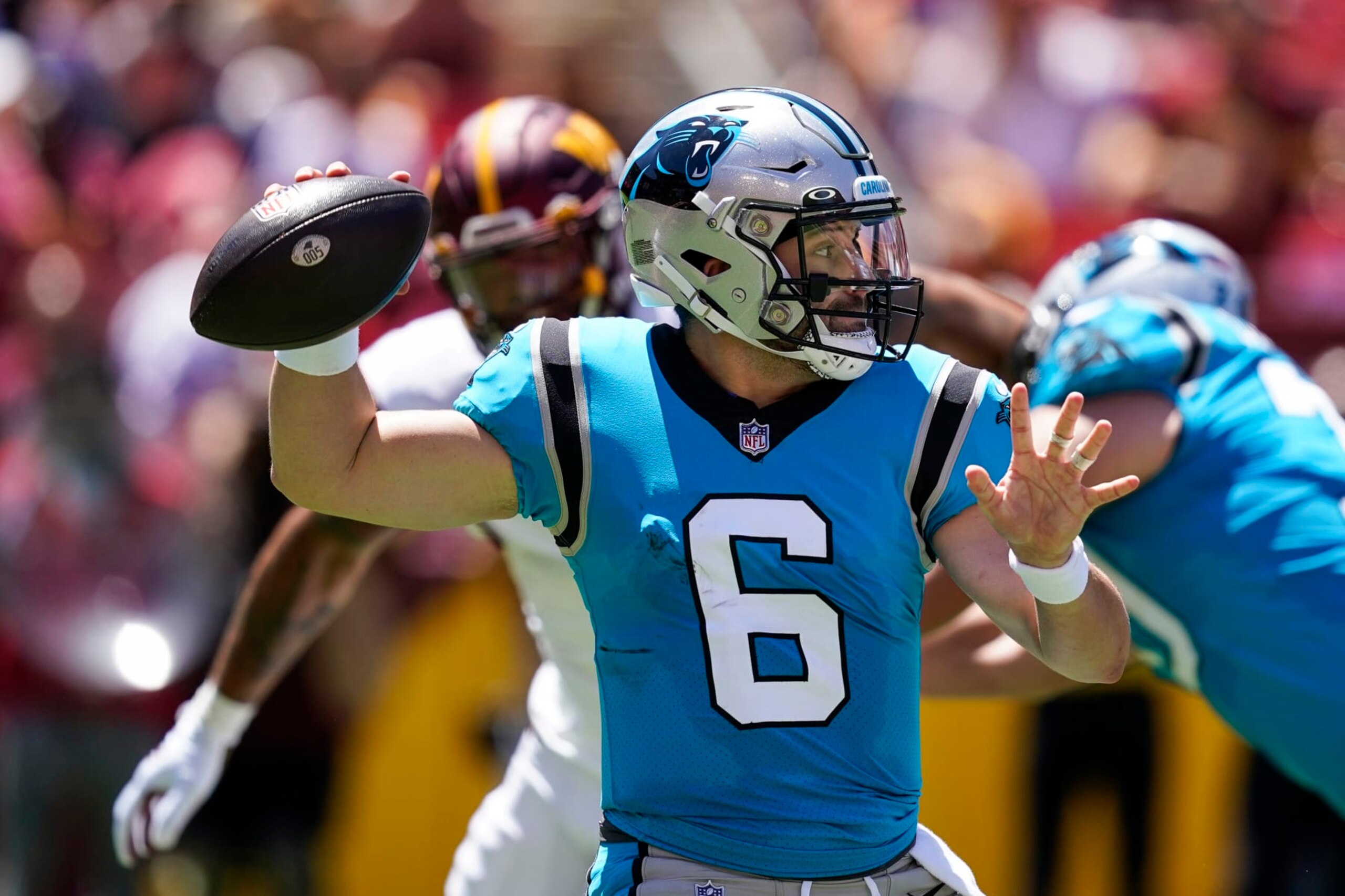 Carolina Panthers quarterback Baker Mayfield throws a pass during the first half of a NFL preseason football game against the Washington Commanders, Saturday, Aug. 13, 2022, in Landover, Md. (AP Photo/Alex Brandon)