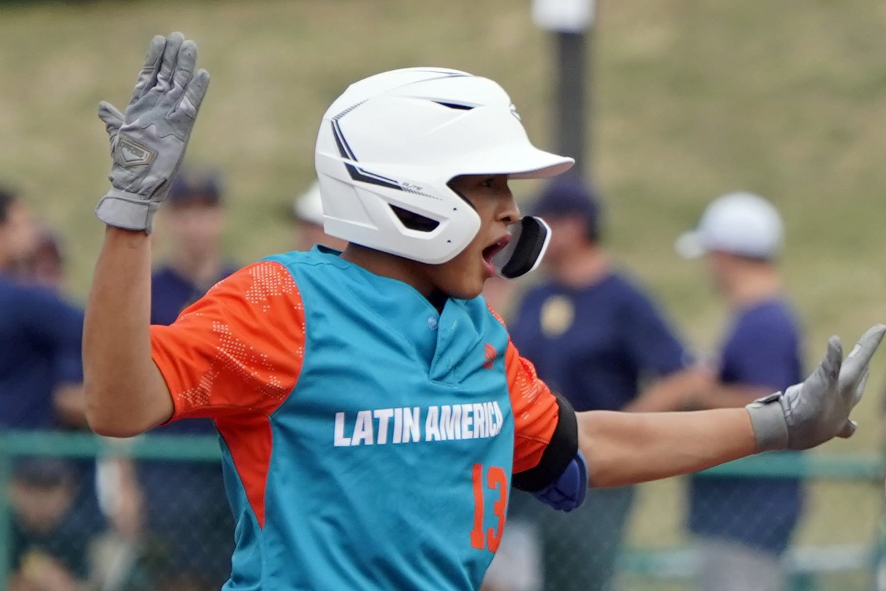 Nicaragua's Luis Garcia (13) celebrates after his double against Curacao during the fourth inning of a baseball game at the Little League World Series tournament in South Williamsport, Pa., Wednesday, Aug. 17, 2022. Curacao won the game 2-0. (AP Photo/Tom E. Puskar)
