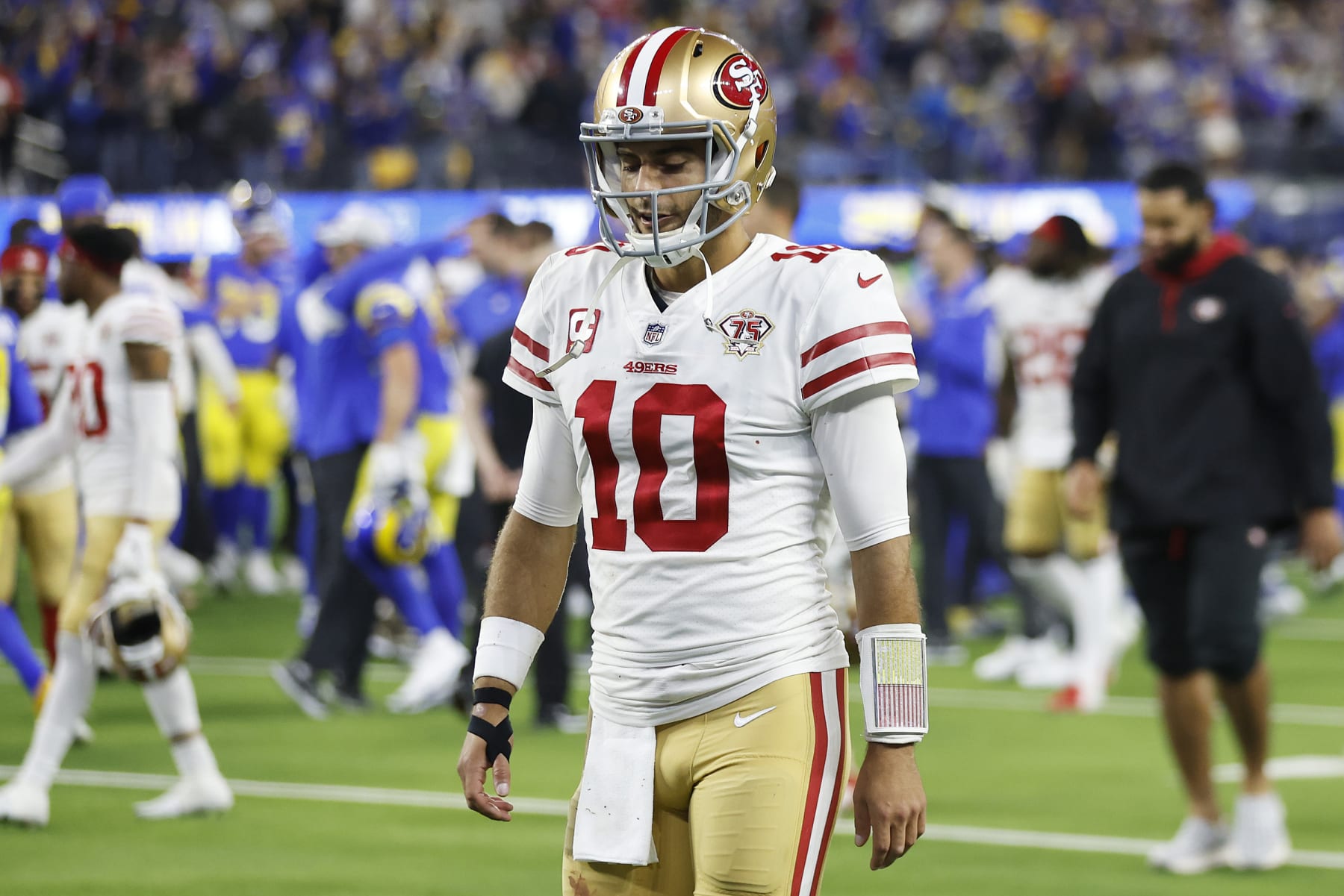 INGLEWOOD, CALIFORNIA - JANUARY 30: Jimmy Garoppolo #10 of the San Francisco 49ers walks off the field after being defeated by the Los Angeles Rams in the NFC Championship Game at SoFi Stadium on January 30, 2022 in Inglewood, California. The Rams defeated the 49ers 20-17. (Photo by Christian Petersen/Getty Images)