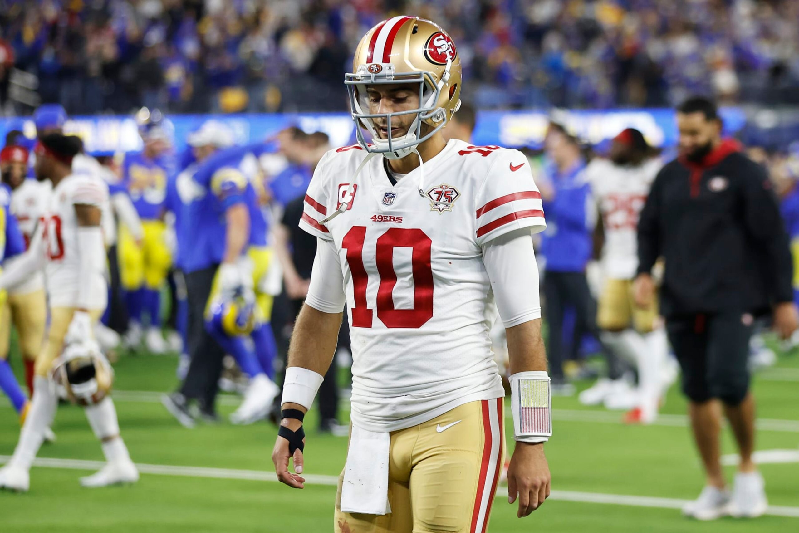 INGLEWOOD, CALIFORNIA - JANUARY 30: Jimmy Garoppolo #10 of the San Francisco 49ers walks off the field after being defeated by the Los Angeles Rams in the NFC Championship Game at SoFi Stadium on January 30, 2022 in Inglewood, California. The Rams defeated the 49ers 20-17. (Photo by Christian Petersen/Getty Images)