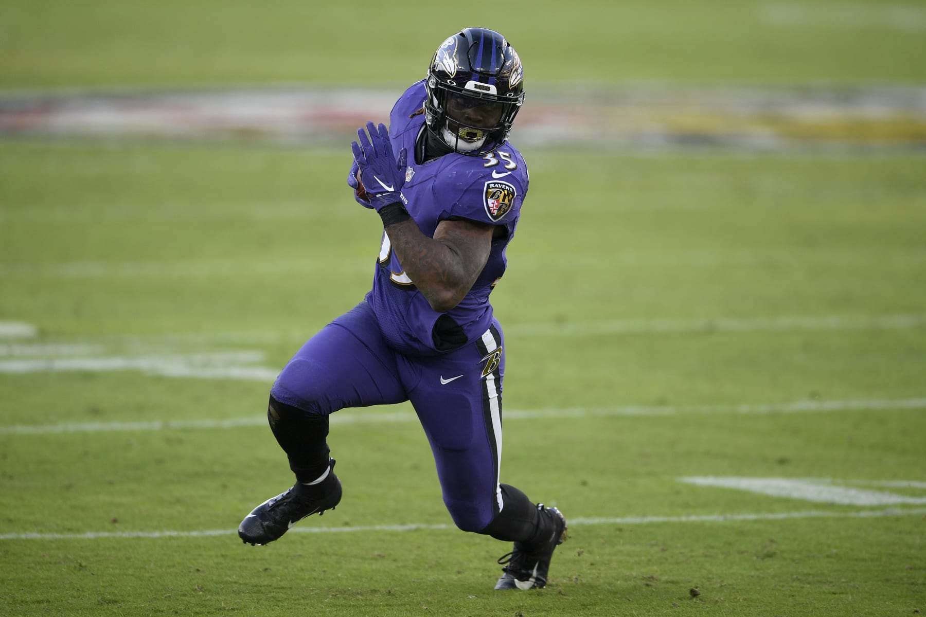 Baltimore Ravens running back Gus Edwards (35) runs with the ball during the second half of an NFL football game against the New York Giants, Sunday, Dec. 27, 2020, in Baltimore. (AP Photo/Nick Wass)