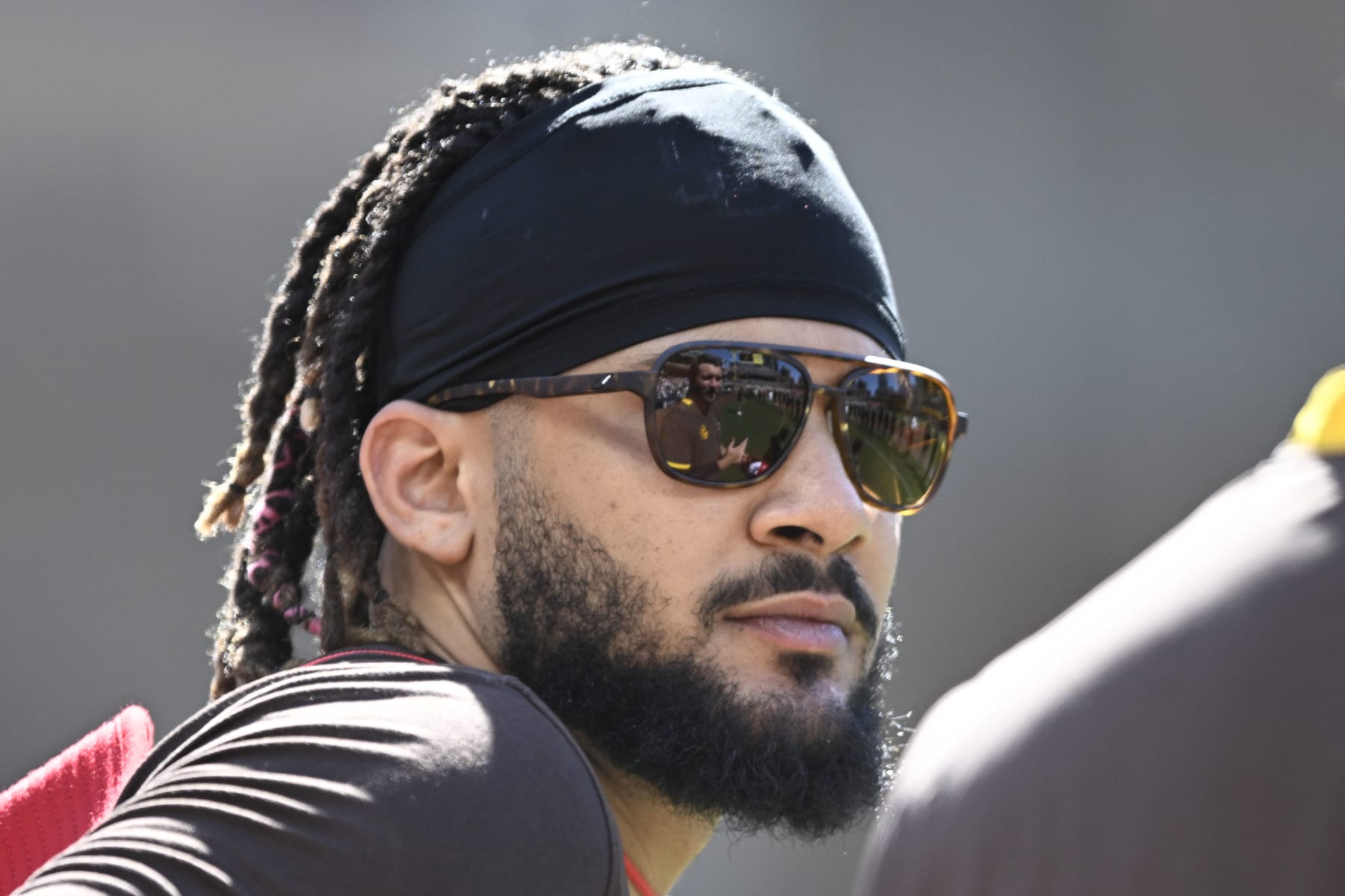 SAN DIEGO, CA - JULY 4:  Fernando Tatis Jr. #23 of the San Diego Padres looks on before a baseball game against the Seattle Mariners July 4, 2022 at Petco Park in San Diego, California. (Photo by Denis Poroy/Getty Images)