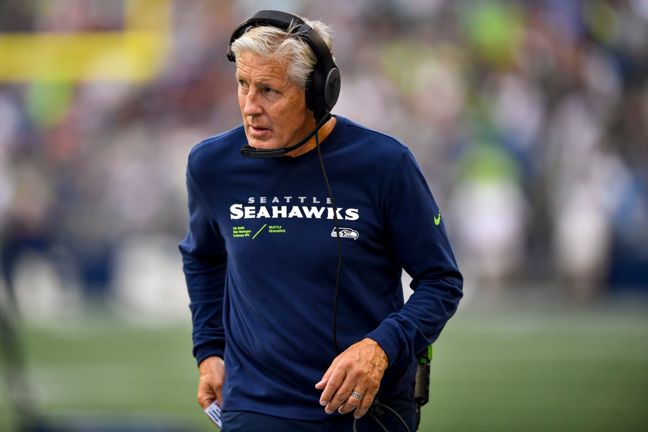 SEATTLE, WASHINGTON - AUGUST 18: Head coach Pete Carroll of the Seattle Seahawks walks the sideline in the third quarter during the preseason game against the Chicago Bears at Lumen Field on August 18, 2022 in Seattle, Washington. (Photo by Jane Gershovich/Getty Images)