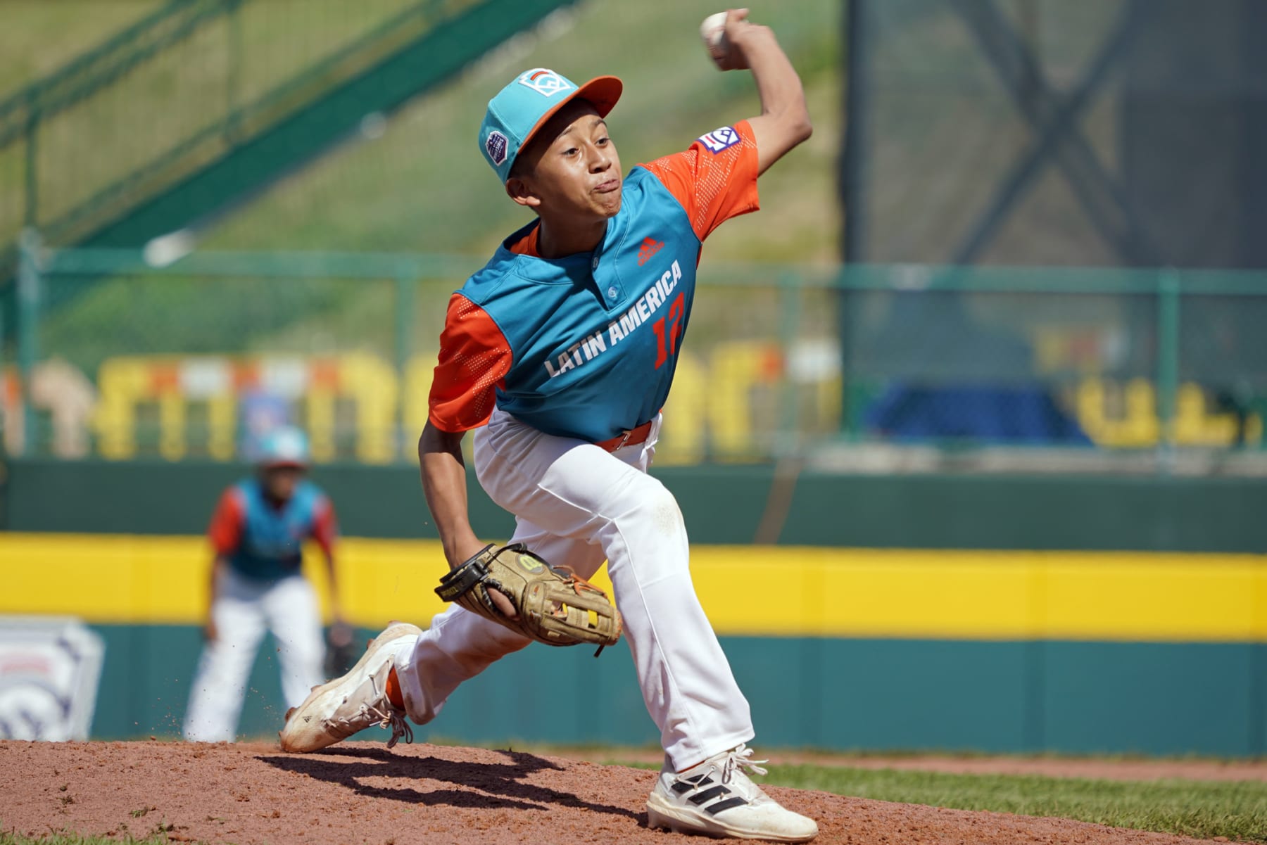 Nicaragua's Johan Saravia (12) delivers a pitch against Panama during the sixth inning of a baseball game at the Little League World Series tournament in South Williamsport, Pa., Tuesday, Aug. 23, 2022. Nicaragua won the game 8-1. (AP Photo/Tom E. Puskar)