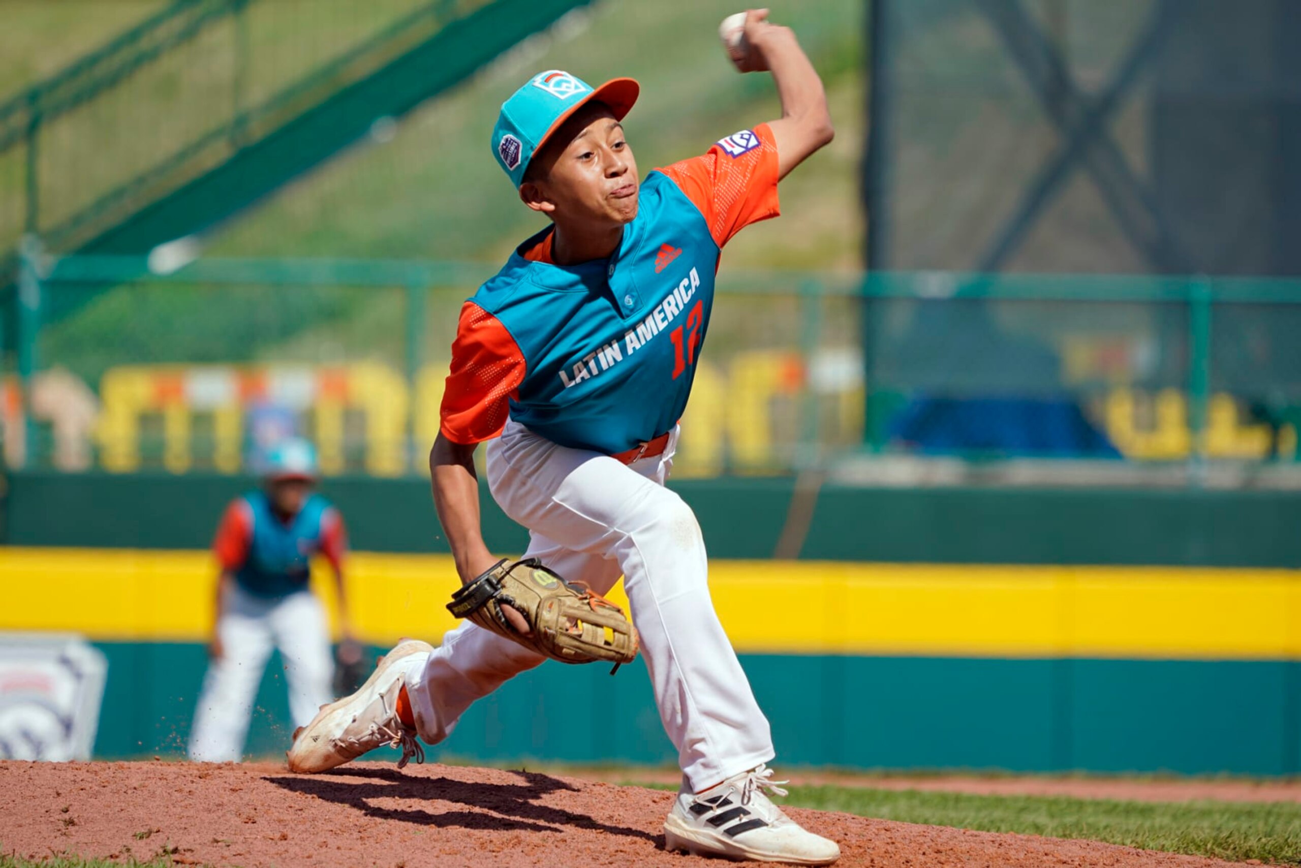Nicaragua's Johan Saravia (12) delivers a pitch against Panama during the sixth inning of a baseball game at the Little League World Series tournament in South Williamsport, Pa., Tuesday, Aug. 23, 2022. Nicaragua won the game 8-1. (AP Photo/Tom E. Puskar)