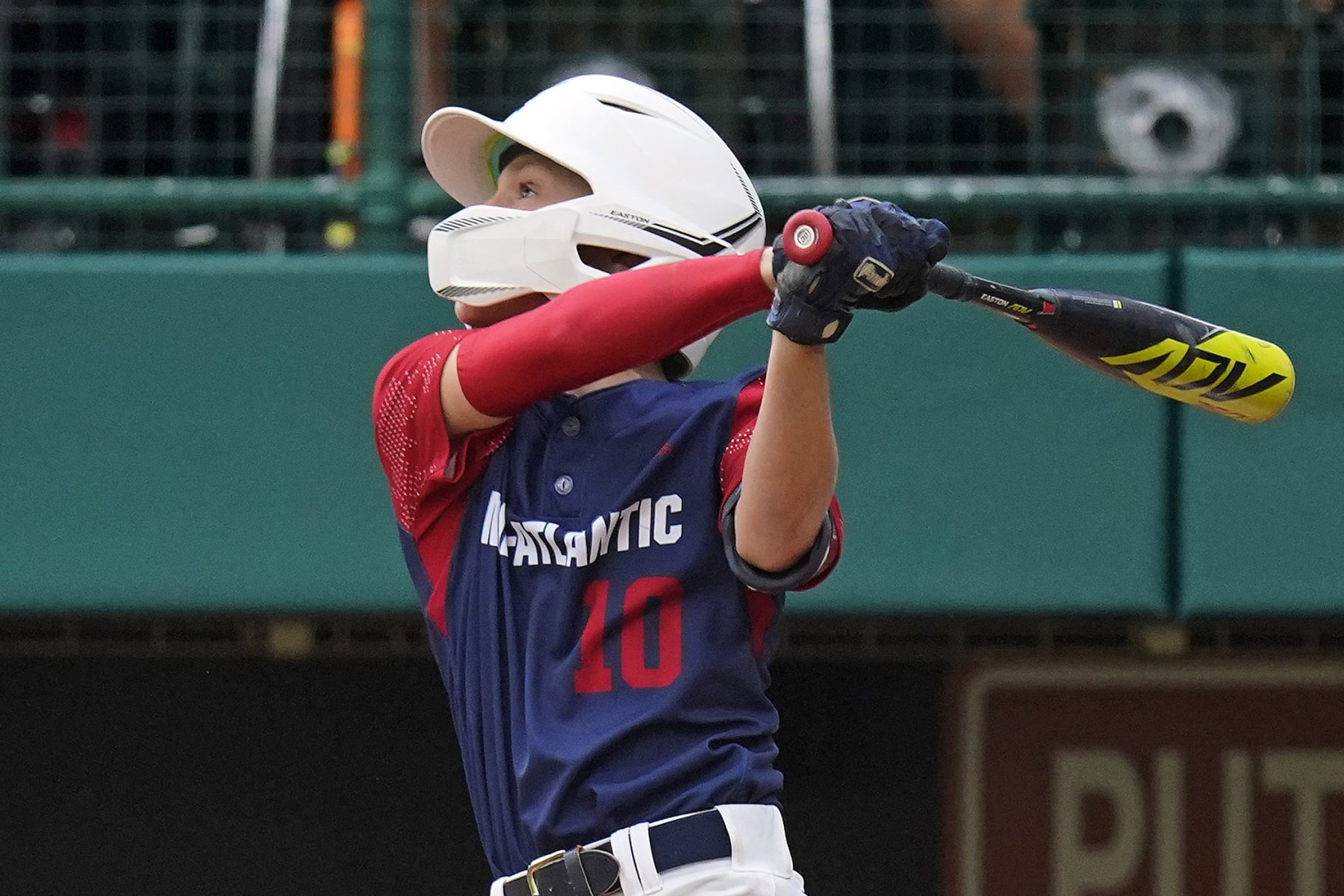 Hollidaysburg, Pa.'s Tyler McGough (10) follows through on a double to centerfield, driving in three-runs, during the fourth inning of a baseball game against Hagerstown, Ind., at the Little League World Series in South Williamsport, Pa., Tuesday, Aug. 23, 2022. Pennsylvania won in four innings, 10-0. (AP Photo/Gene J. Puskar)