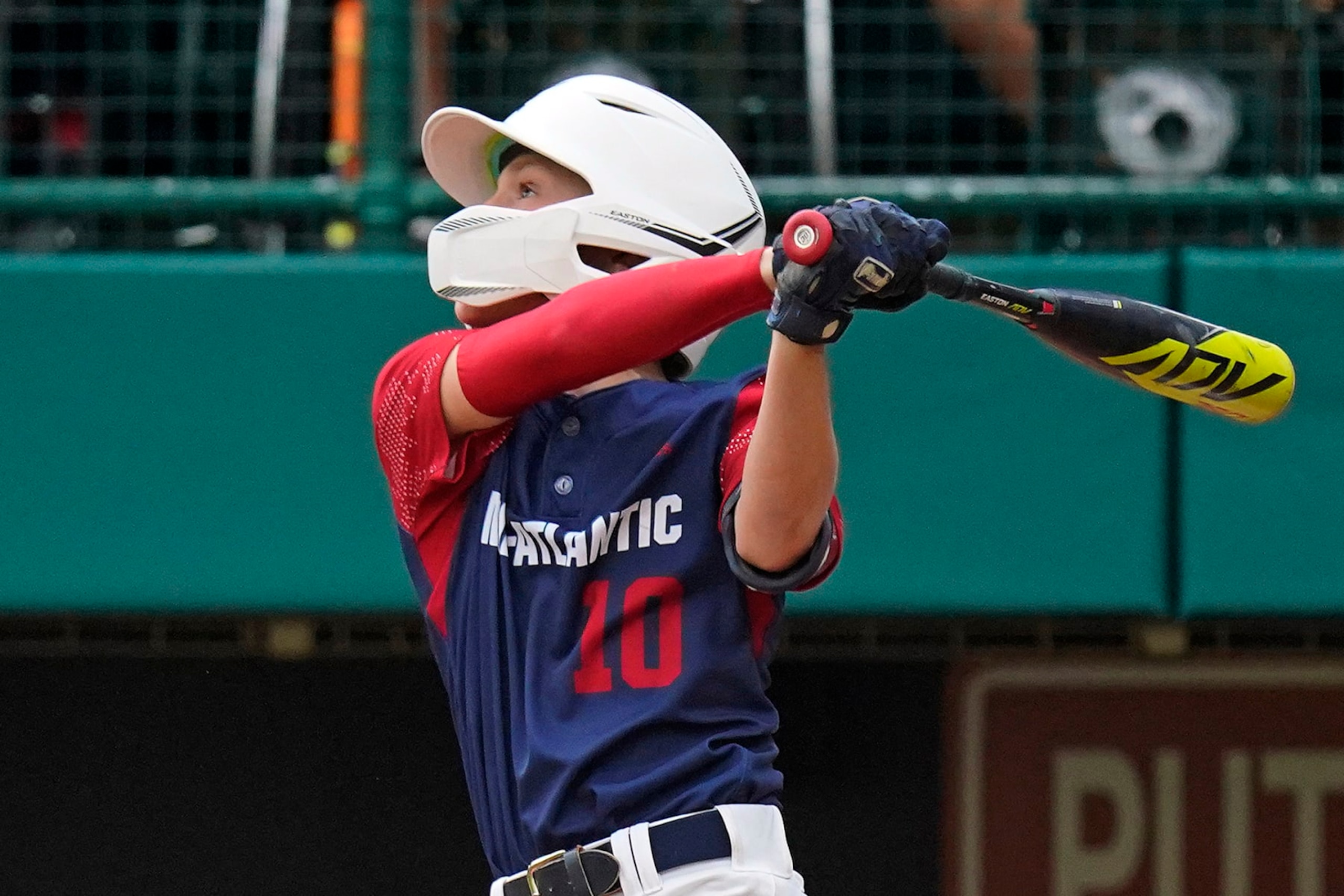 Hollidaysburg, Pa.'s Tyler McGough (10) follows through on a double to centerfield, driving in three-runs, during the fourth inning of a baseball game against Hagerstown, Ind., at the Little League World Series in South Williamsport, Pa., Tuesday, Aug. 23, 2022. Pennsylvania won in four innings, 10-0. (AP Photo/Gene J. Puskar)