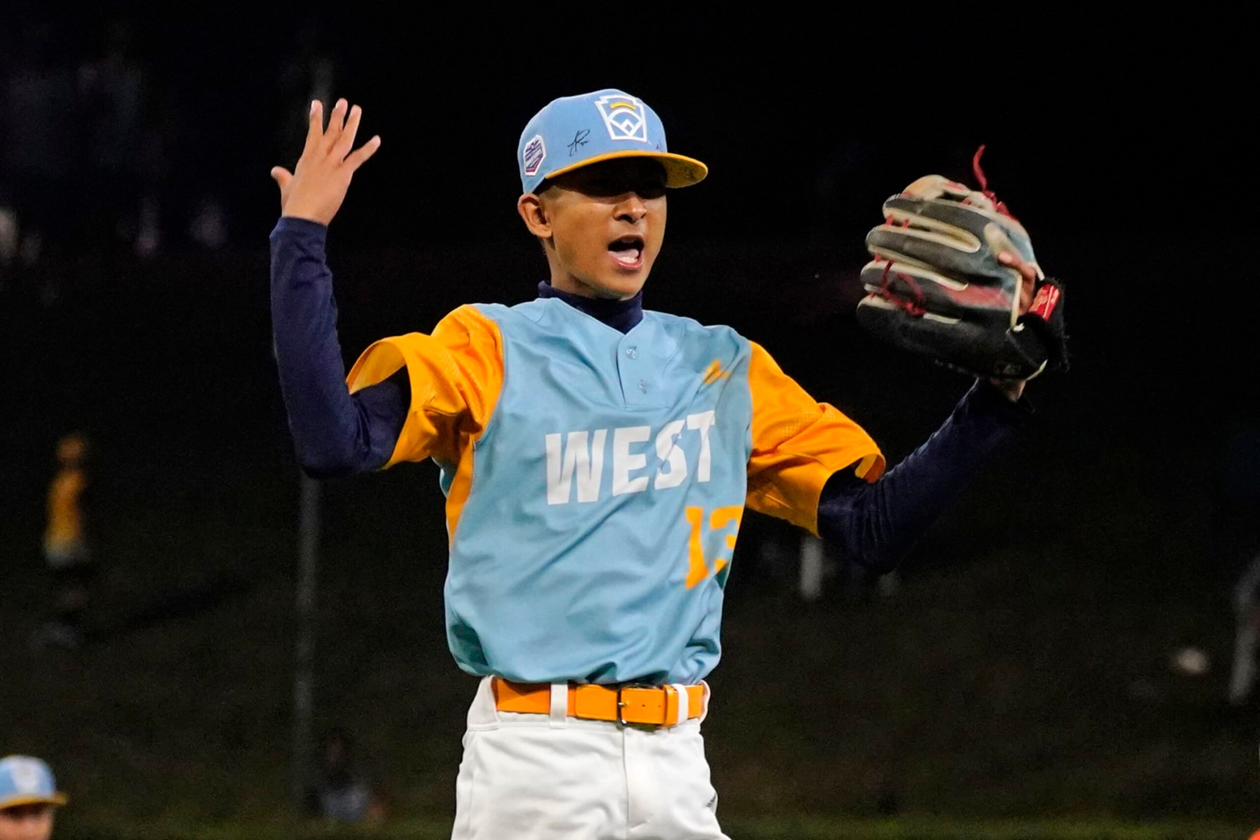 Honolulu's Jaron Lancaster celebrates after getting the final out of a win over Pearland, Texas, in a baseball game at the Little League World Series in South Williamsport, Pa., Monday, Aug. 22, 2022. (AP Photo/Gene J. Puskar)