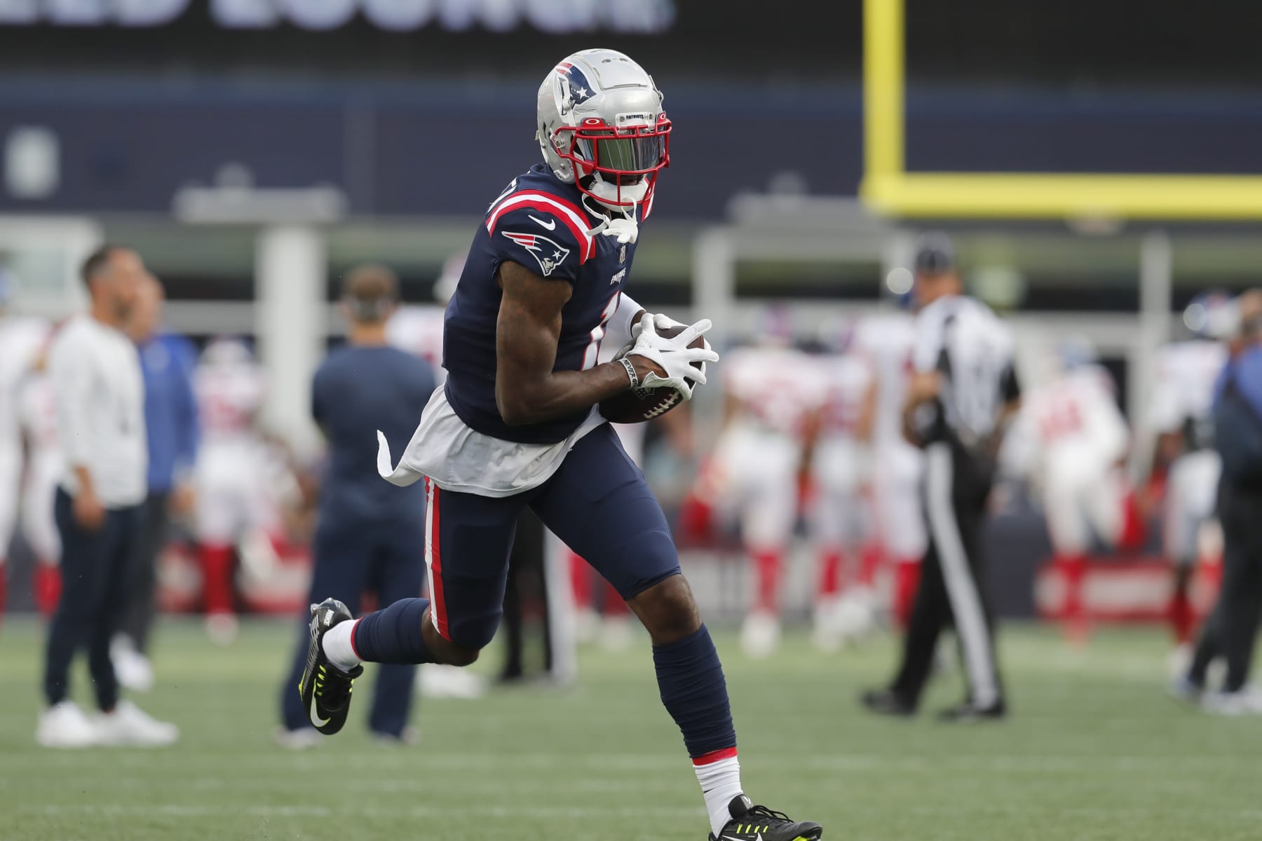New England Patriots wide receiver DeVante Parker (1) warms up prior to an NFL football game between New York Giants and the New England Patriots, Thursday, Aug. 11, 2022, in Foxborough, Mass. (AP Photo/Michael Dwyer)