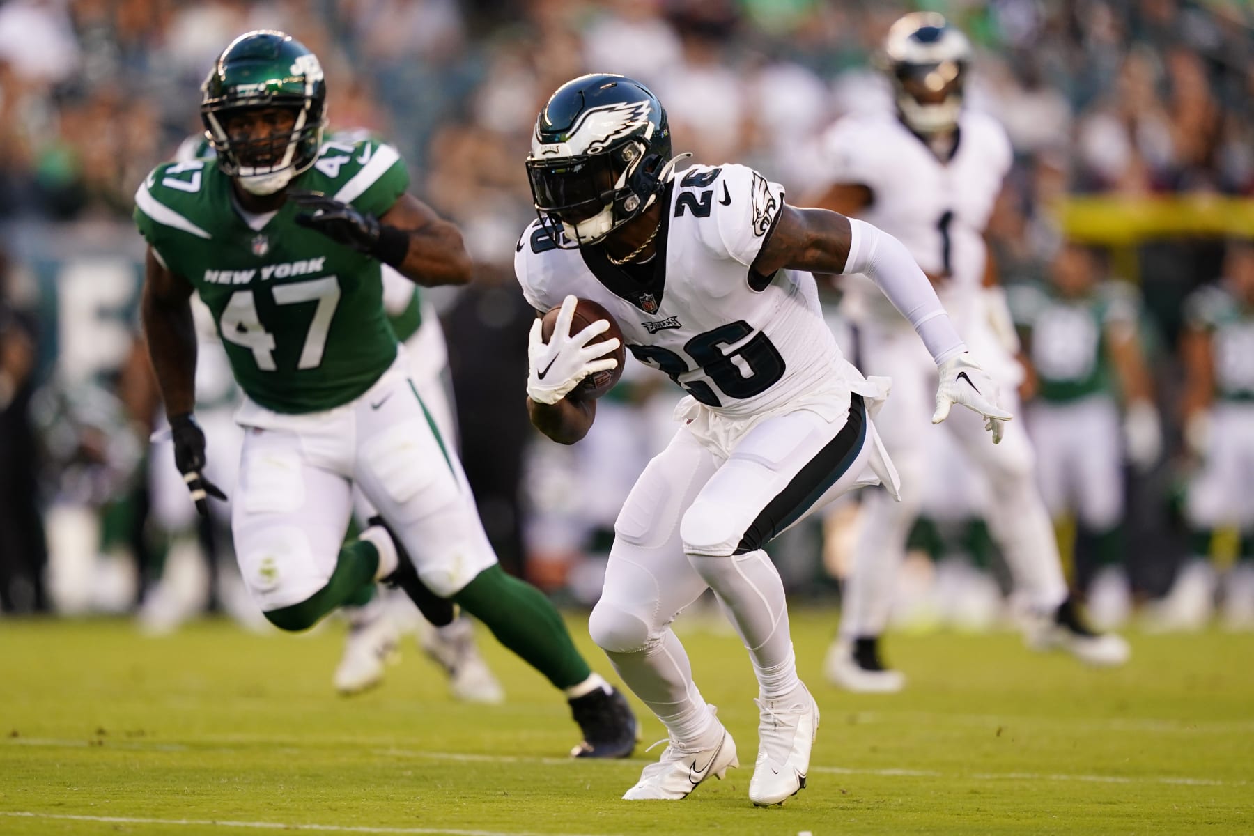Philadelphia Eagles' Miles Sanders runs with the ball during the first half of a preseason NFL football game against the New York Jets on Friday, Aug. 12, 2022, in Philadelphia. (AP Photo/Matt Slocum)