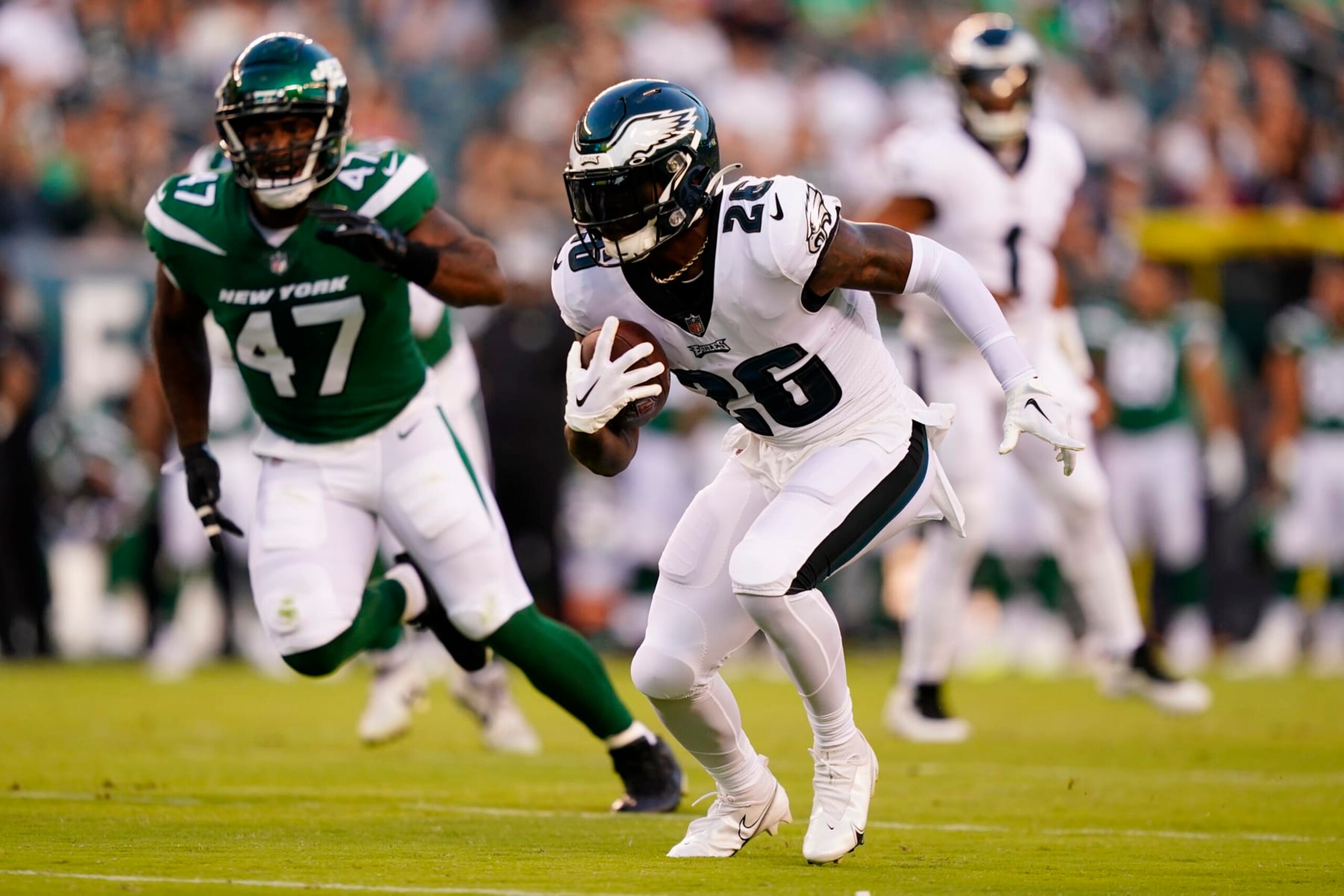 Philadelphia Eagles' Miles Sanders runs with the ball during the first half of a preseason NFL football game against the New York Jets on Friday, Aug. 12, 2022, in Philadelphia. (AP Photo/Matt Slocum)