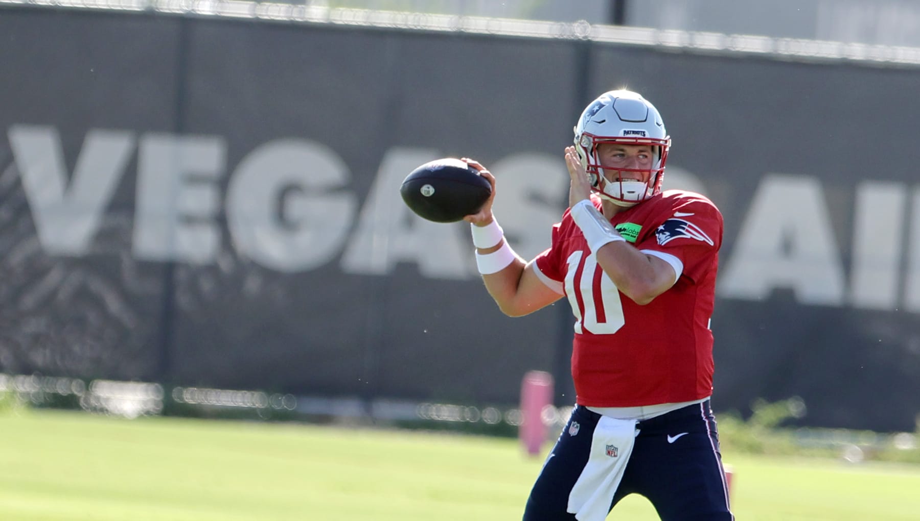 HENDERSON, NEVADA - AUGUST 23: Quarterback Mac Jones #10 of the New England Patriots throws during a joint practice with the Las Vegas Raiders at the Las Vegas Raiders Headquarters/Intermountain Healthcare Performance Center on August 23, 2022 in Henderson, Nevada. The Patriots and Raiders will play a preseason game at Allegiant Stadium in Las Vegas on August 26. (Photo by Ethan Miller/Getty Images)