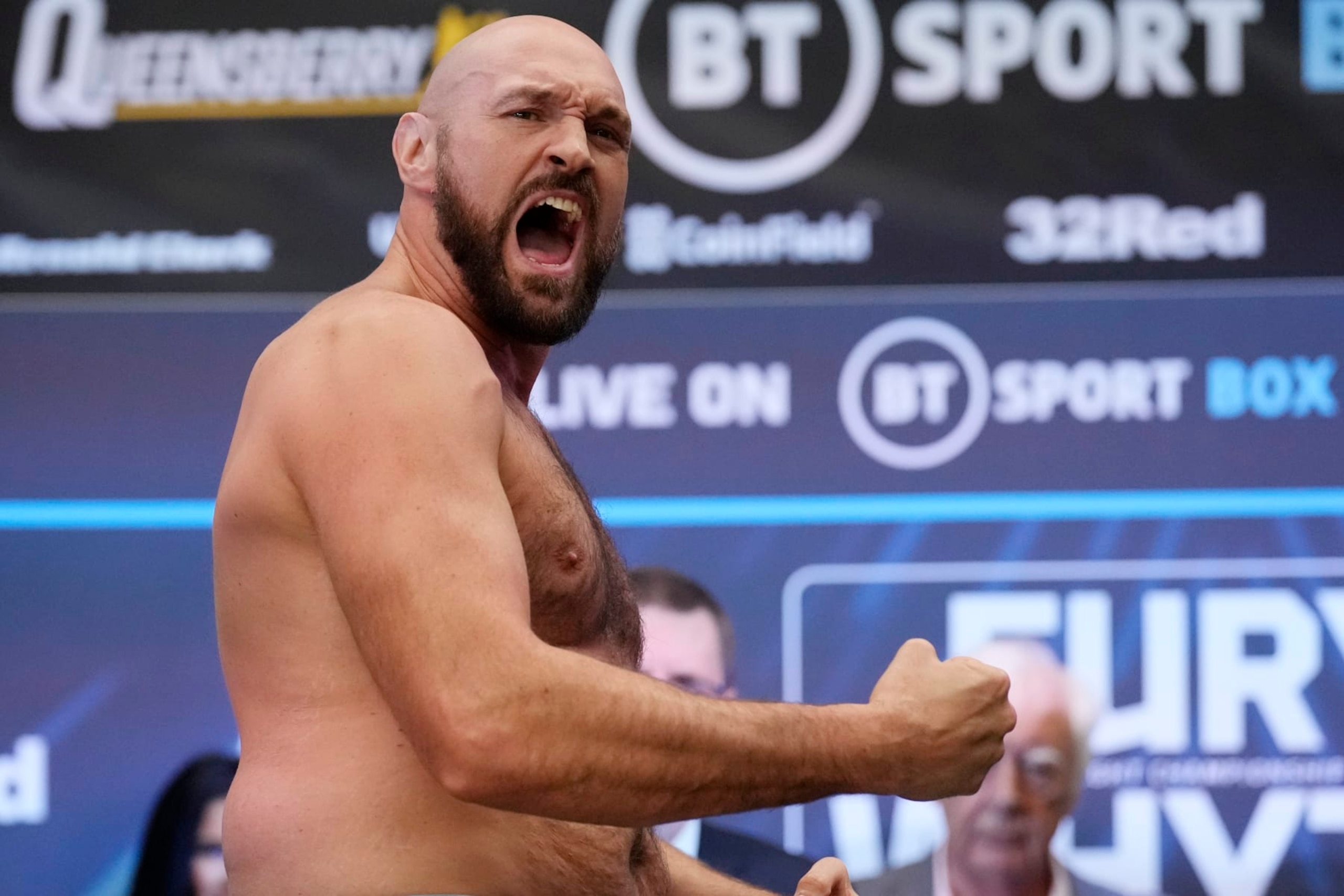 British heavyweight boxers Tyson Fury and Dillian Whyte go head-to-head as they take part in their weigh-in at the Boxpark Wembley venue, near Wembley Stadium, in London, Friday, April 22, 2022. Wembley Stadium will stage Tyson Fury's defense of the WBC heavyweight title against British countryman Dillian Whyte on Saturday. (AP Photo/Matt Dunham) British heavyweight boxers Tyson Fury and Dillian Whyte go head-to-head as they take part in their weigh-in at the Boxpark Wembley venue, near Wembley Stadium, in London, Friday, April 22, 2022. Wembley Stadium will stage Tyson Fury's defense of the WBC heavyweight title against British countryman Dillian Whyte on Saturday. (AP Photo/Matt Dunham)