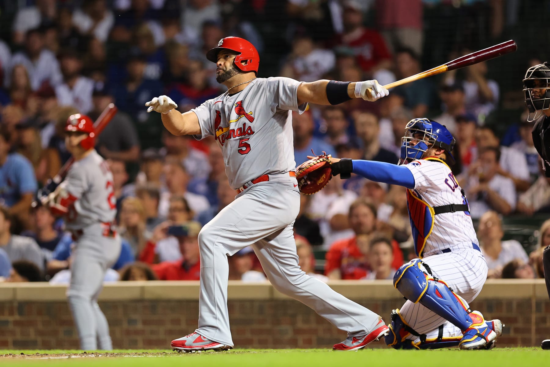 CHICAGO, ILLINOIS - AUGUST 22: Albert Pujols #5 of the St. Louis Cardinals hits a solo home run during the seventh inning off Drew Smyly #11 of the Chicago Cubs (not pictured) at Wrigley Field on August 22, 2022 in Chicago, Illinois. (Photo by Michael Reaves/Getty Images) CHICAGO, ILLINOIS - AUGUST 22: Albert Pujols #5 of the St. Louis Cardinals hits a solo home run during the seventh inning off Drew Smyly #11 of the Chicago Cubs (not pictured) at Wrigley Field on August 22, 2022 in Chicago, Illinois. (Photo by Michael Reaves/Getty Images)