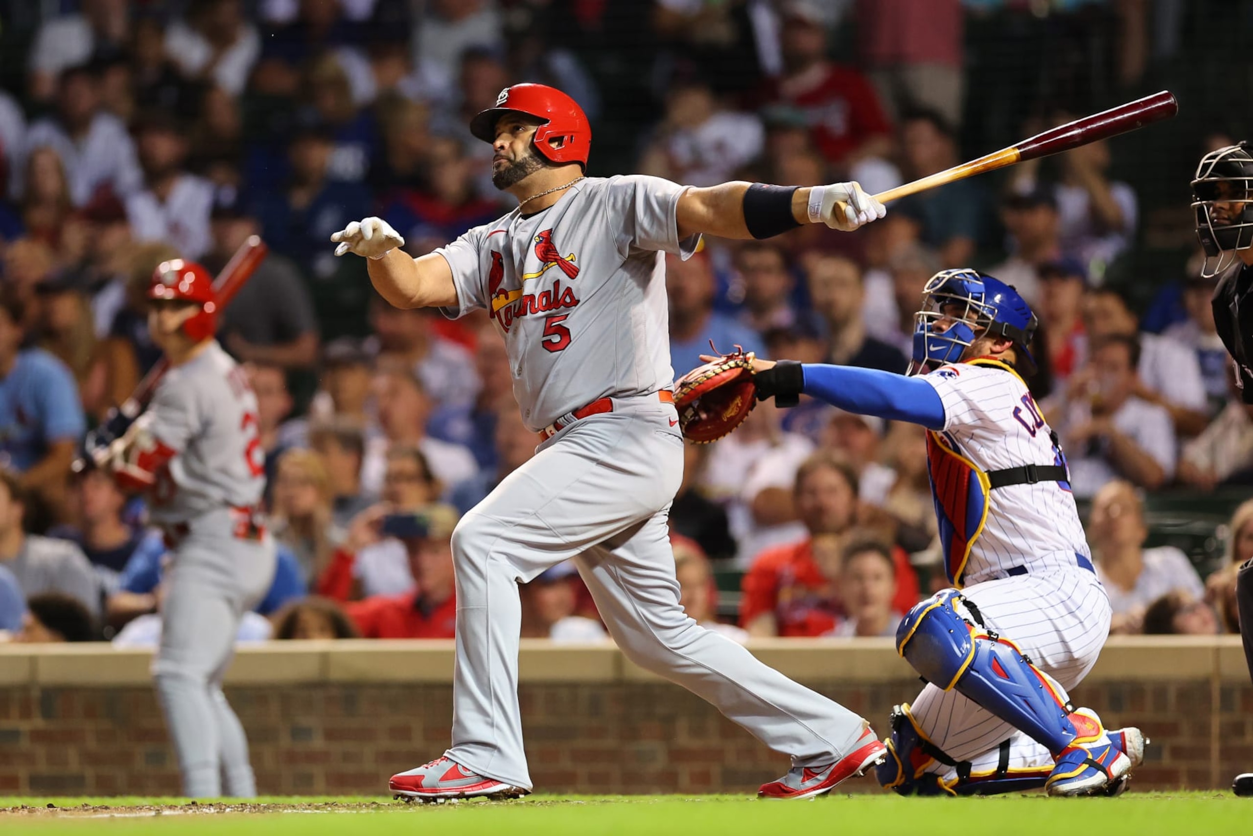 CHICAGO, ILLINOIS - AUGUST 22: Albert Pujols #5 of the St. Louis Cardinals hits a solo home run during the seventh inning off Drew Smyly #11 of the Chicago Cubs (not pictured) at Wrigley Field on August 22, 2022 in Chicago, Illinois. (Photo by Michael Reaves/Getty Images)