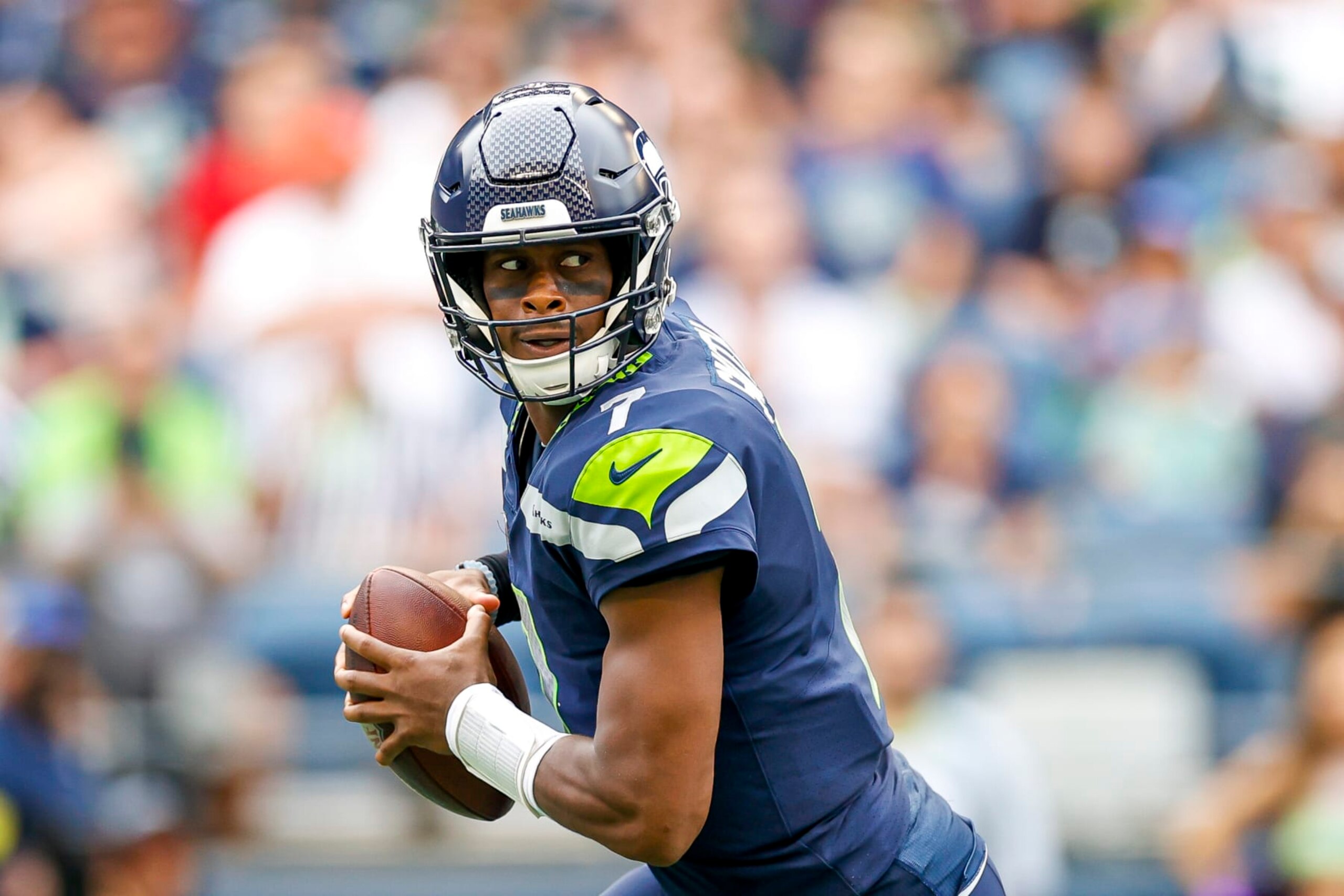 SEATTLE, WASHINGTON - AUGUST 18: Geno Smith #7 of the Seattle Seahawks looks to make a pass in the first quarter during the preseason game against the Chicago Bears at Lumen Field on August 18, 2022 in Seattle, Washington. (Photo by Steph Chambers/Getty Images)
