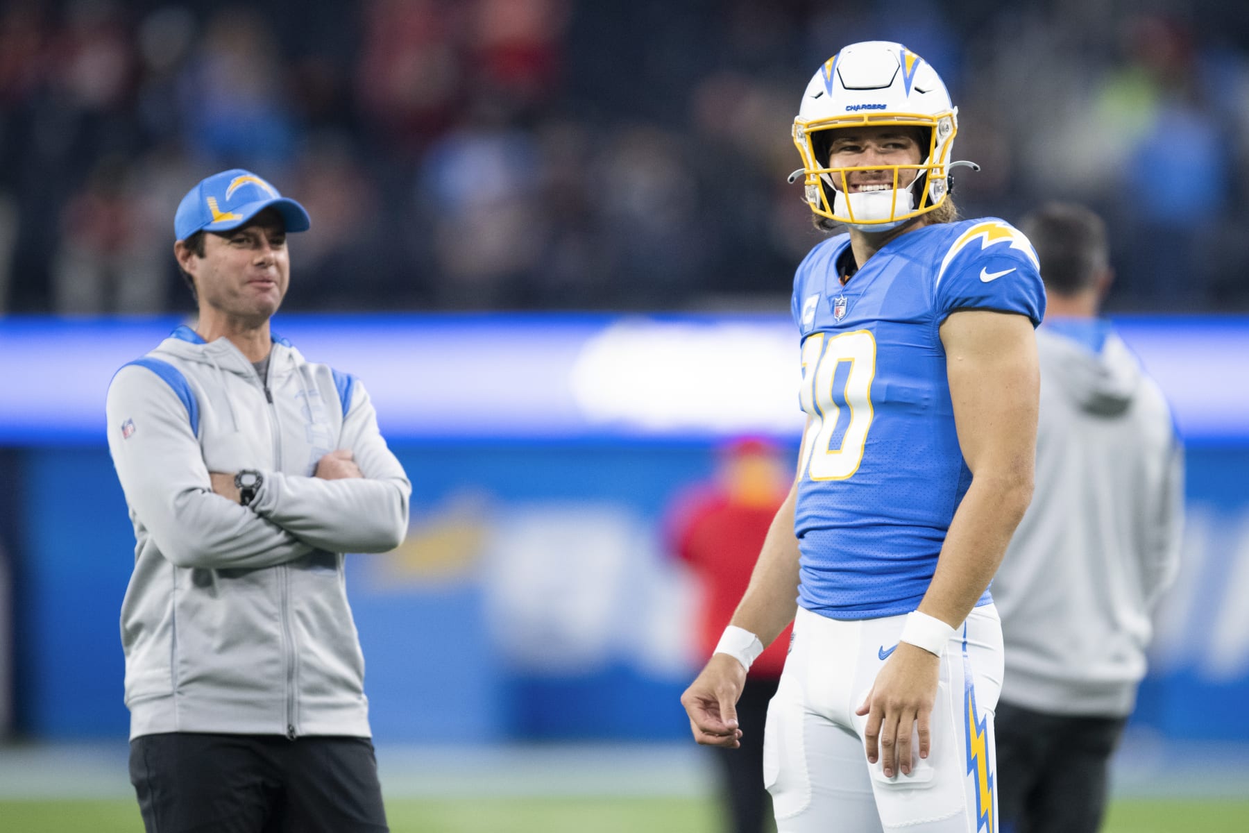 Los Angeles Chargers quarterback Justin Herbert (10) talks to head coach Brandon Staley before an NFL football game against the Kansas City Chiefs Thursday, Dec. 16, 2021, in Inglewood, Calif. (AP Photo/Kyusung Gong)