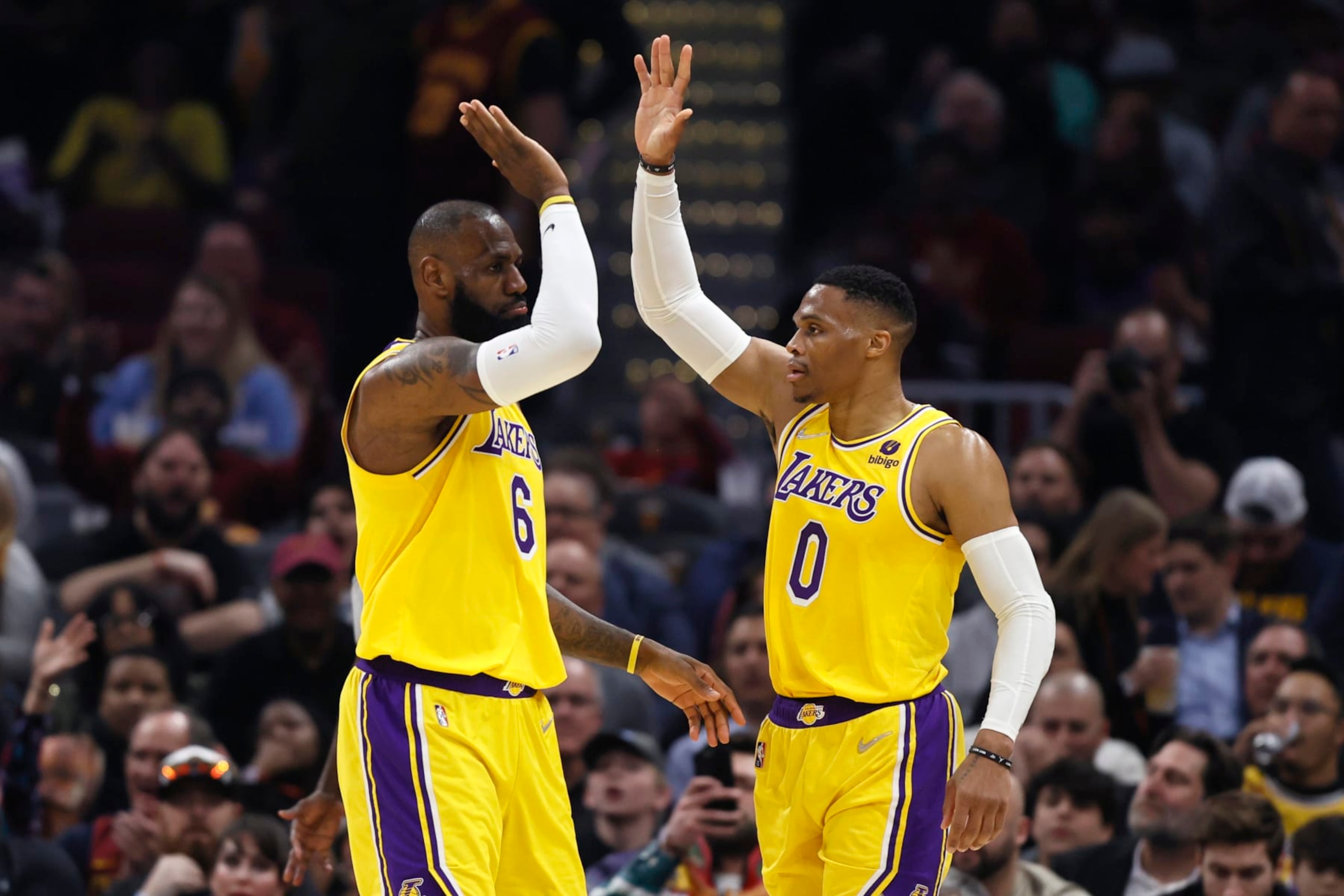 Los Angeles Lakers' LeBron James (6) and Russell Westbrook (0) play against the Cleveland Cavaliers during the first half of an NBA basketball game, Monday, March 21, 2022, in Cleveland. (AP Photo/Ron Schwane)