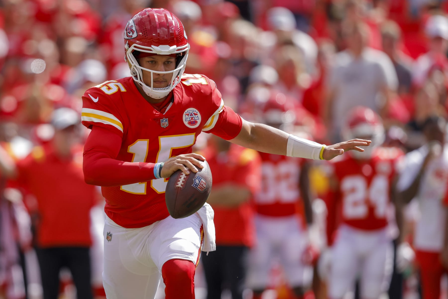 KANSAS CITY, MO - AUGUST 20: Patrick Mahomes #15 of the Kansas City Chiefs scrambles away from defensive pressure during the first quarter of a preseason game against the Washington Commanders at Arrowhead Stadium on August 20, 2022 in Kansas City, Missouri. (Photo by David Eulitt/Getty Images)