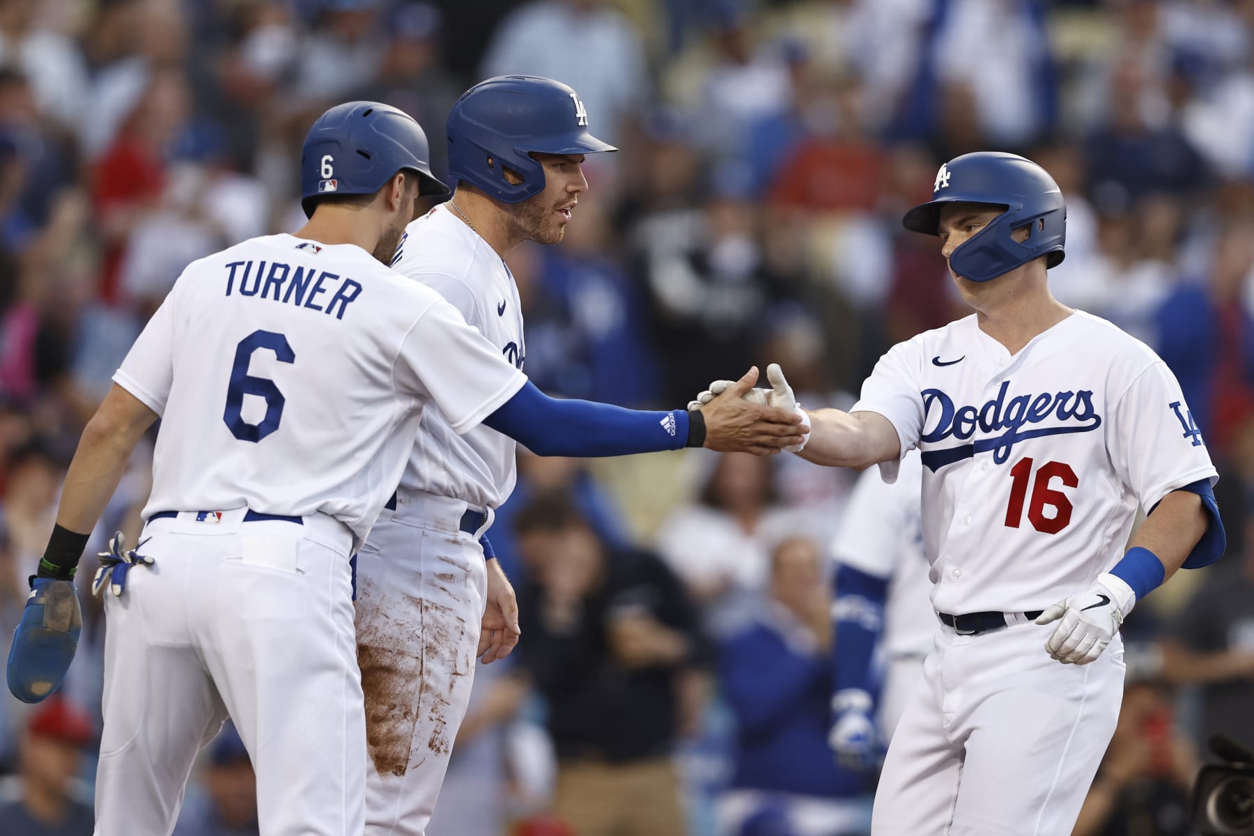 LOS ANGELES, CALIFORNIA - JUNE 15: Will Smith #16 of the Los Angeles Dodgers celebrates with teammates Trea Turner #6 and Freddie Freeman #5 after hitting a three run home run against the Los Angeles Angels during the first inning at Dodger Stadium on June 15, 2022 in Los Angeles, California. (Photo by Michael Owens/Getty Images) LOS ANGELES, CALIFORNIA - JUNE 15: Will Smith #16 of the Los Angeles Dodgers celebrates with teammates Trea Turner #6 and Freddie Freeman #5 after hitting a three run home run against the Los Angeles Angels during the first inning at Dodger Stadium on June 15, 2022 in Los Angeles, California. (Photo by Michael Owens/Getty Images)