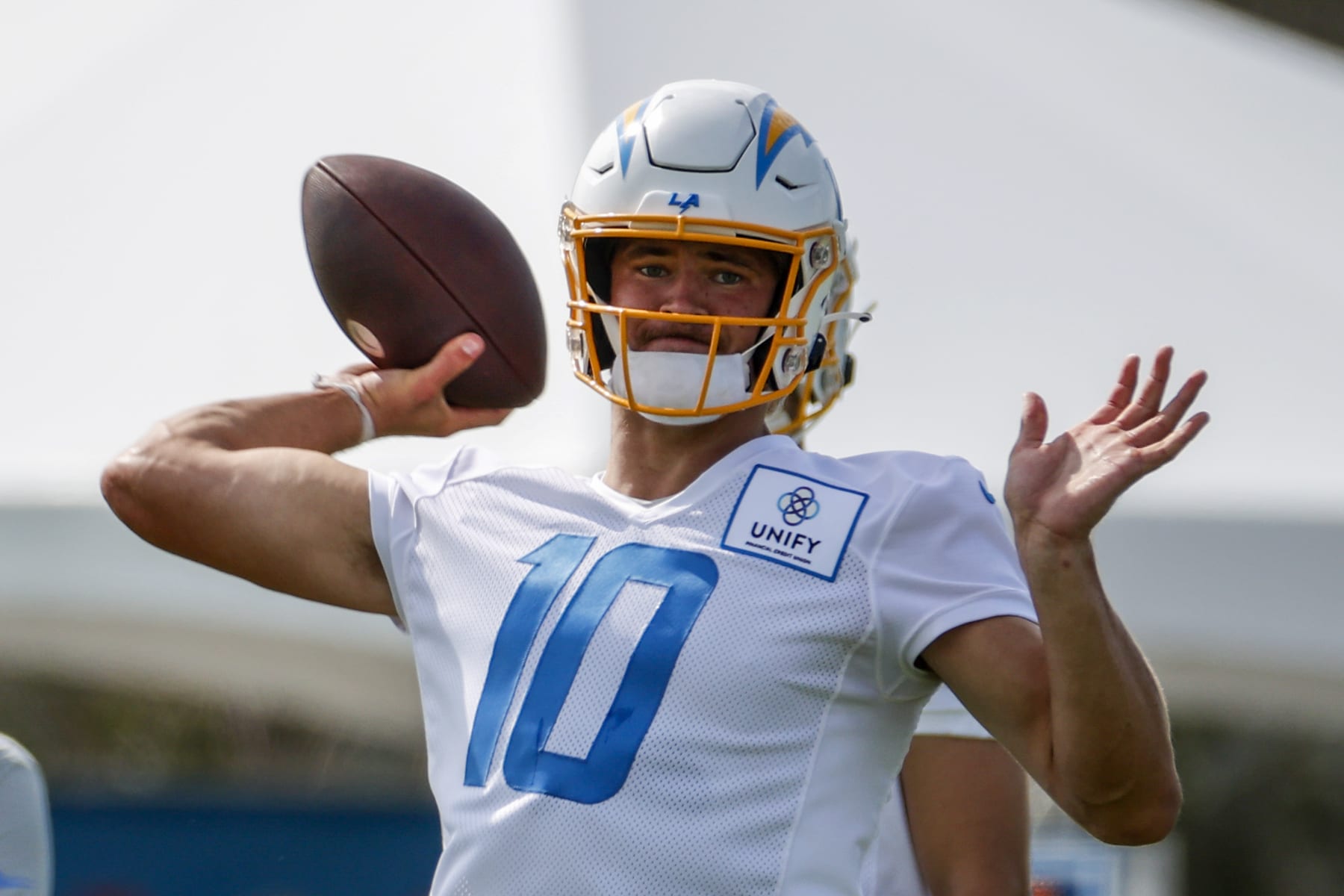Los Angeles Chargers quarterback Justin Herbert (10) throws a pass during the NFL football team's training camp, Wednesday, July 27, 2022, in Costa Mesa, Calif. (AP Photo/Ringo H.W. Chiu)