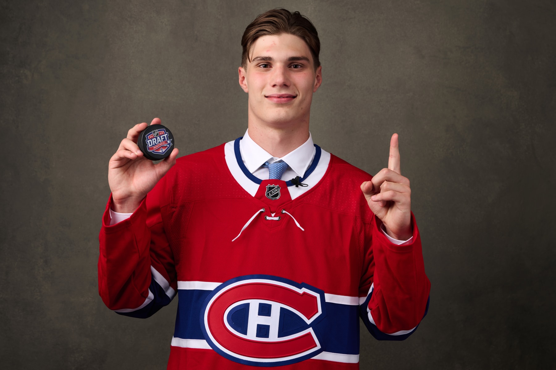 MONTREAL, QUEBEC - JULY 07: Juraj Slafkovsky, #1 pick by the Montreal Canadiens, poses for a portrait during the 2022 Upper Deck NHL Draft at Bell Centre on July 07, 2022 in Montreal, Quebec, Canada. (Photo by Minas Panagiotakis/Getty Images)